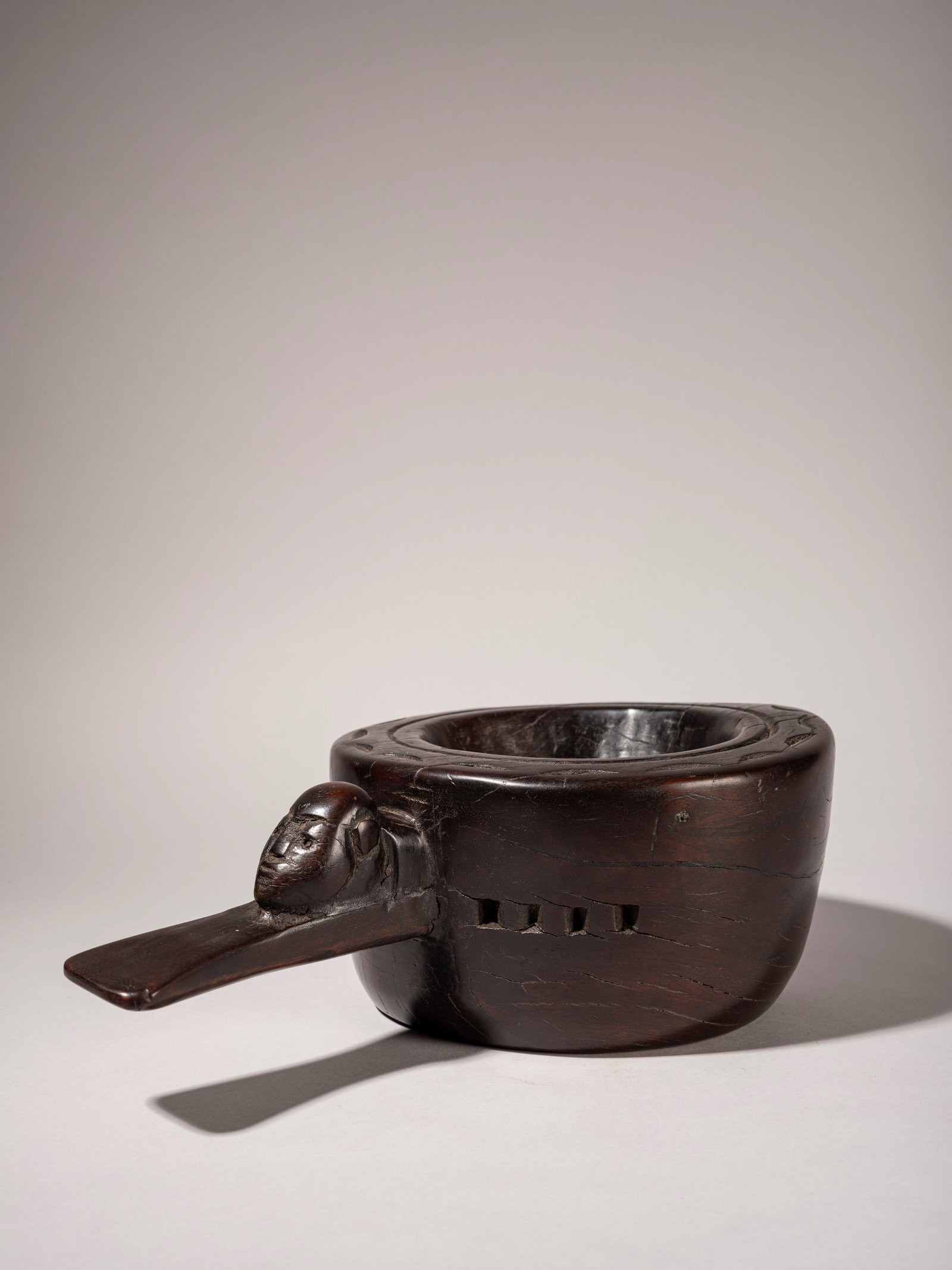 RITUAL MORTAR , The Naga ethnic group, Assam, north-western India: l cm 33 Made of fine wood with geometric carvings and an anthropomorphic figure