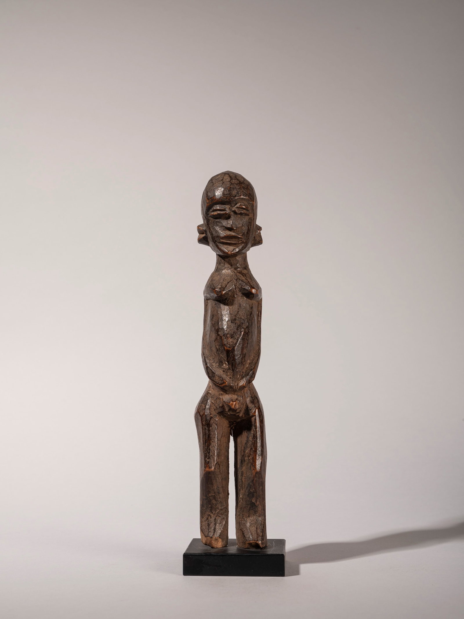 A GROUP OF THREE SMALL FIGURES, Lobi, Burkina Faso, 20th century (1 of 9)