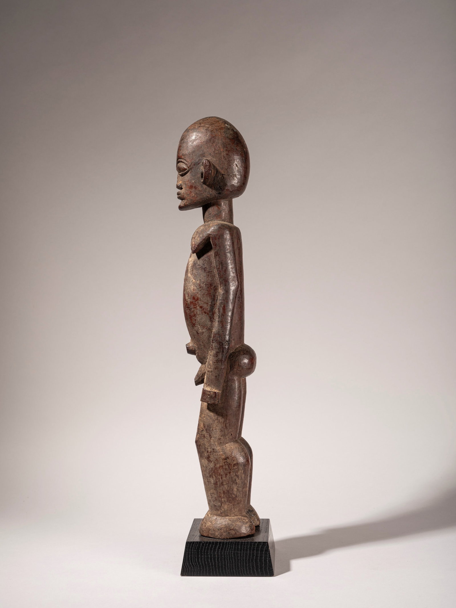FIGURE OF AN ANCESTOR, Lobi, Burkina Faso, mid-20th century: h cm 55 Carved in hardwood.