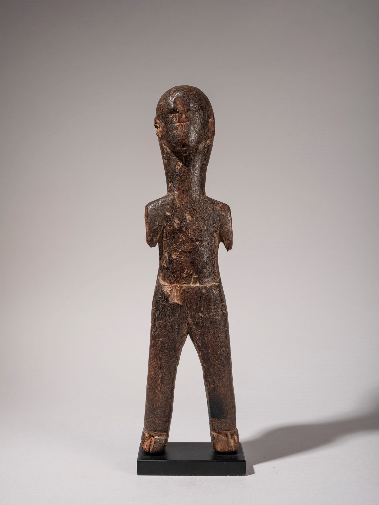 FIGURE OF AN ANCESTOR, Sukuma, Tanzania: h cm 38 Carved in wood.