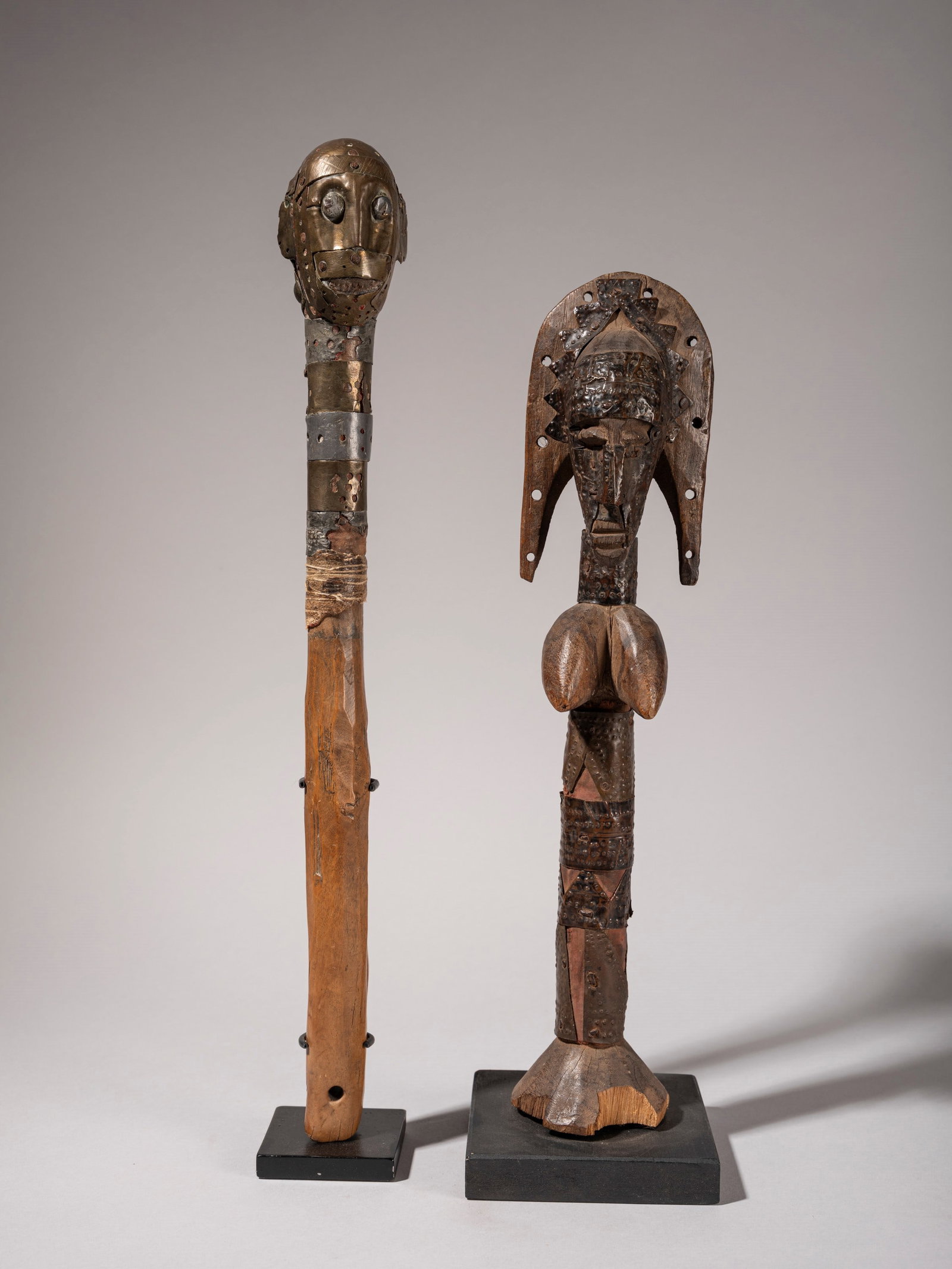 A SET COMPRISING TWO PUPPETS , Bambara, Mali, first half of the 20th century: h max cm 42 Made of wood and brass.