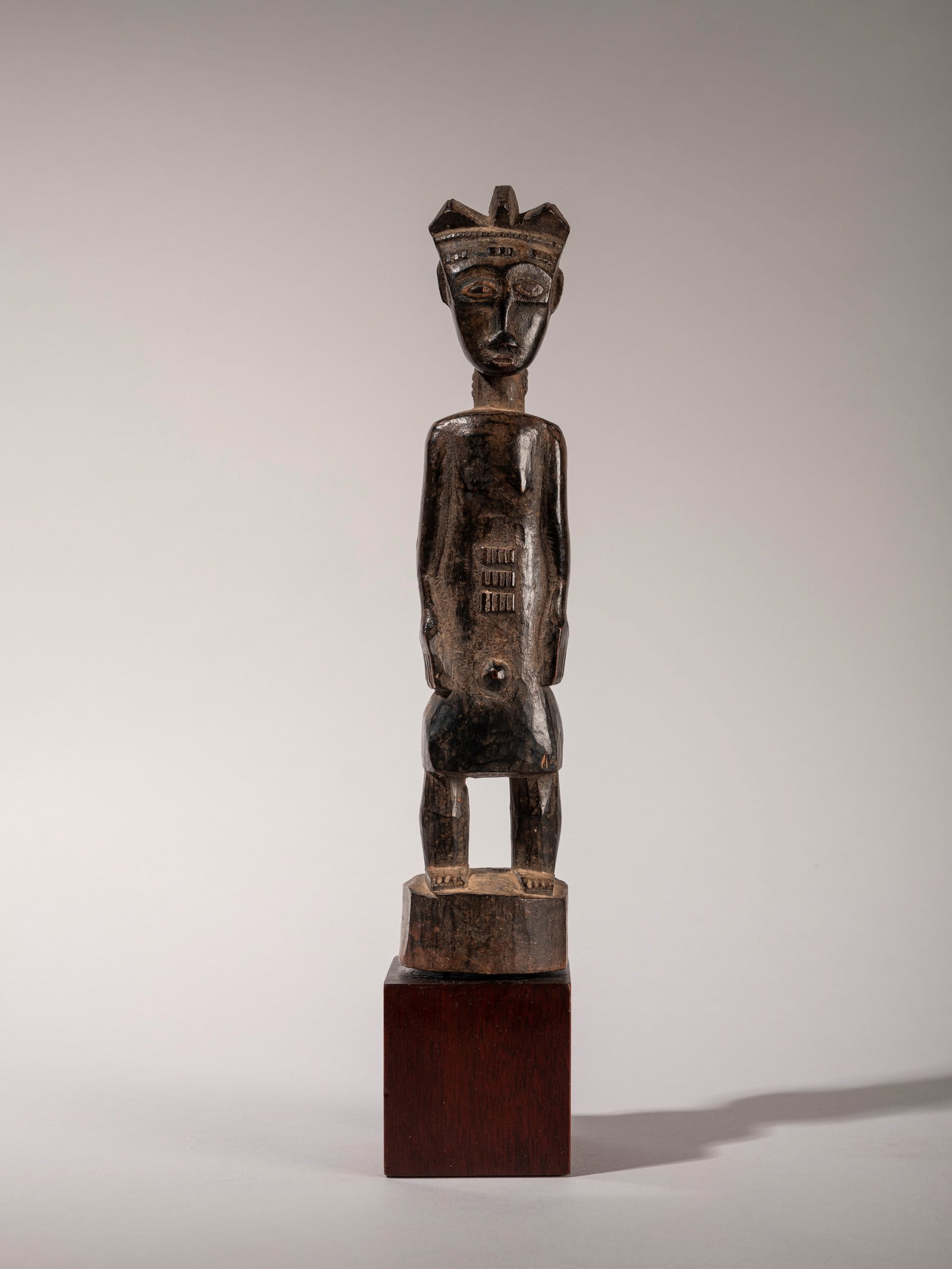 FIGURE OF AN ANCESTOR, Baule, Ivory Coast, mid-20th century: h cm 30 Carved in wood.