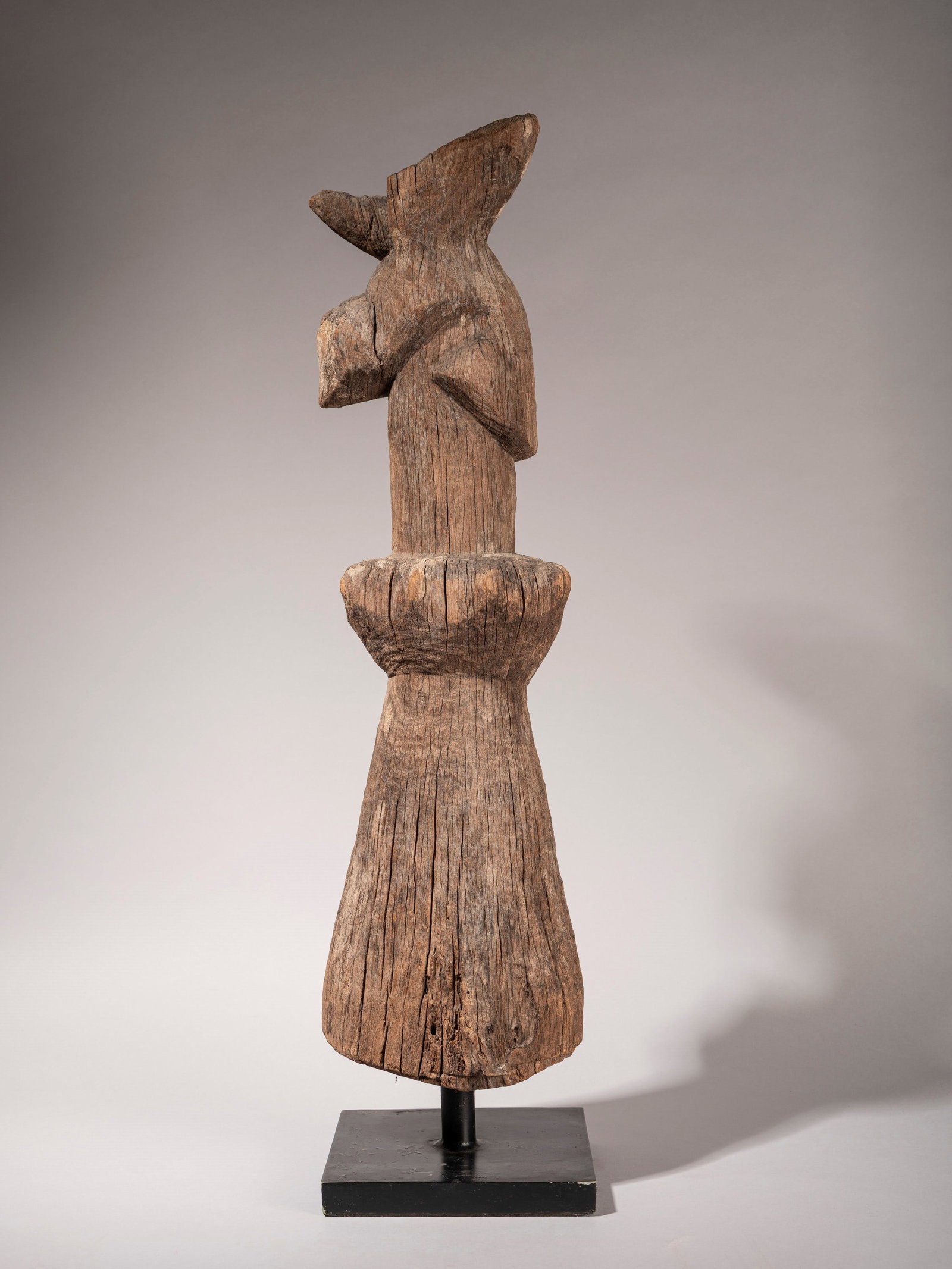 ROOF RIDGE OF A TRADITIONAL HOUSE, Sumba Island, East Indonesia, 20th century: h cm 73 carved wood, characterised by a highly stylised anthropomorphic and zoomorphic design