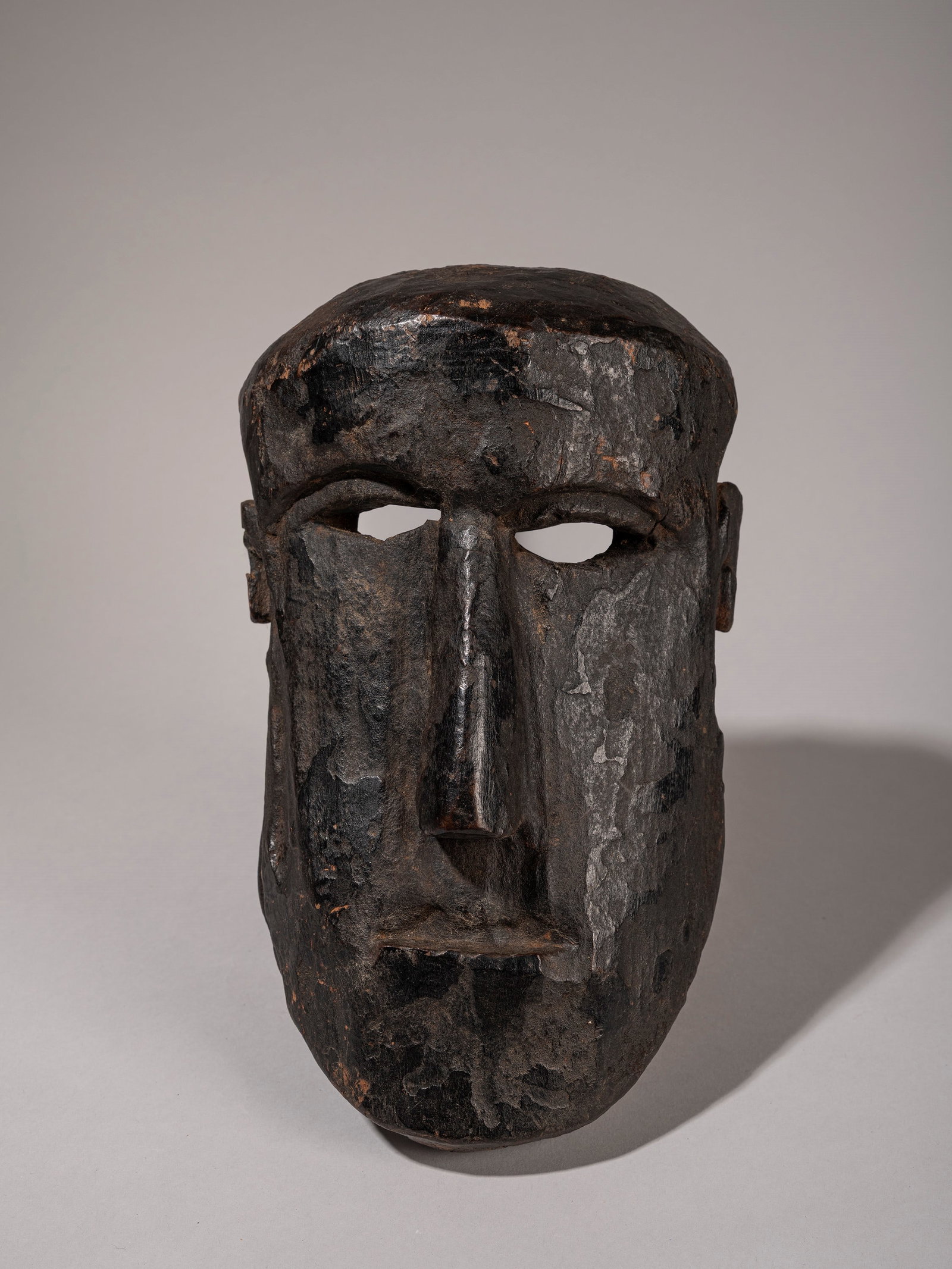 A HIMALAYAN WOODEN MASK, (1 of 2)