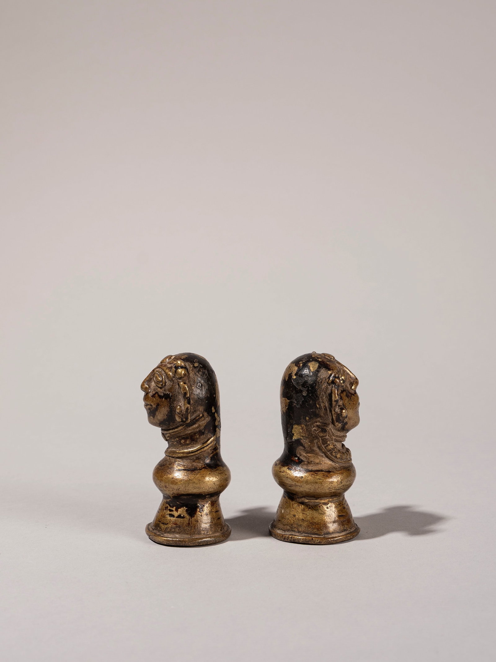 A PAIR OF BRONZES DEPICTING SHIVA AND PARVATI, Madhyapranesh, 19th/20th century: h cm 8 Provenance: Renzo Freschi Collection, Milan.