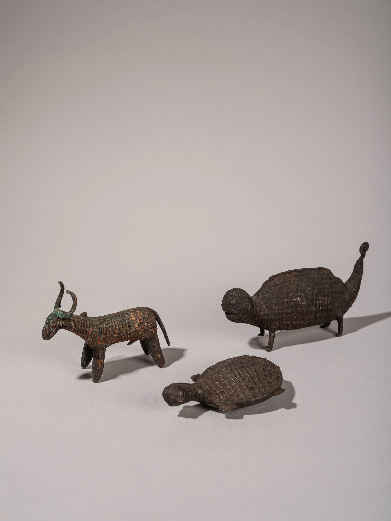 A LOT COMPRISING THREE ZOOMORPHIC KOND BRONZE FIGURES, India, 19th/20th century: l max cm 15 Provenance: Renzo Freschi Collection, Milan.