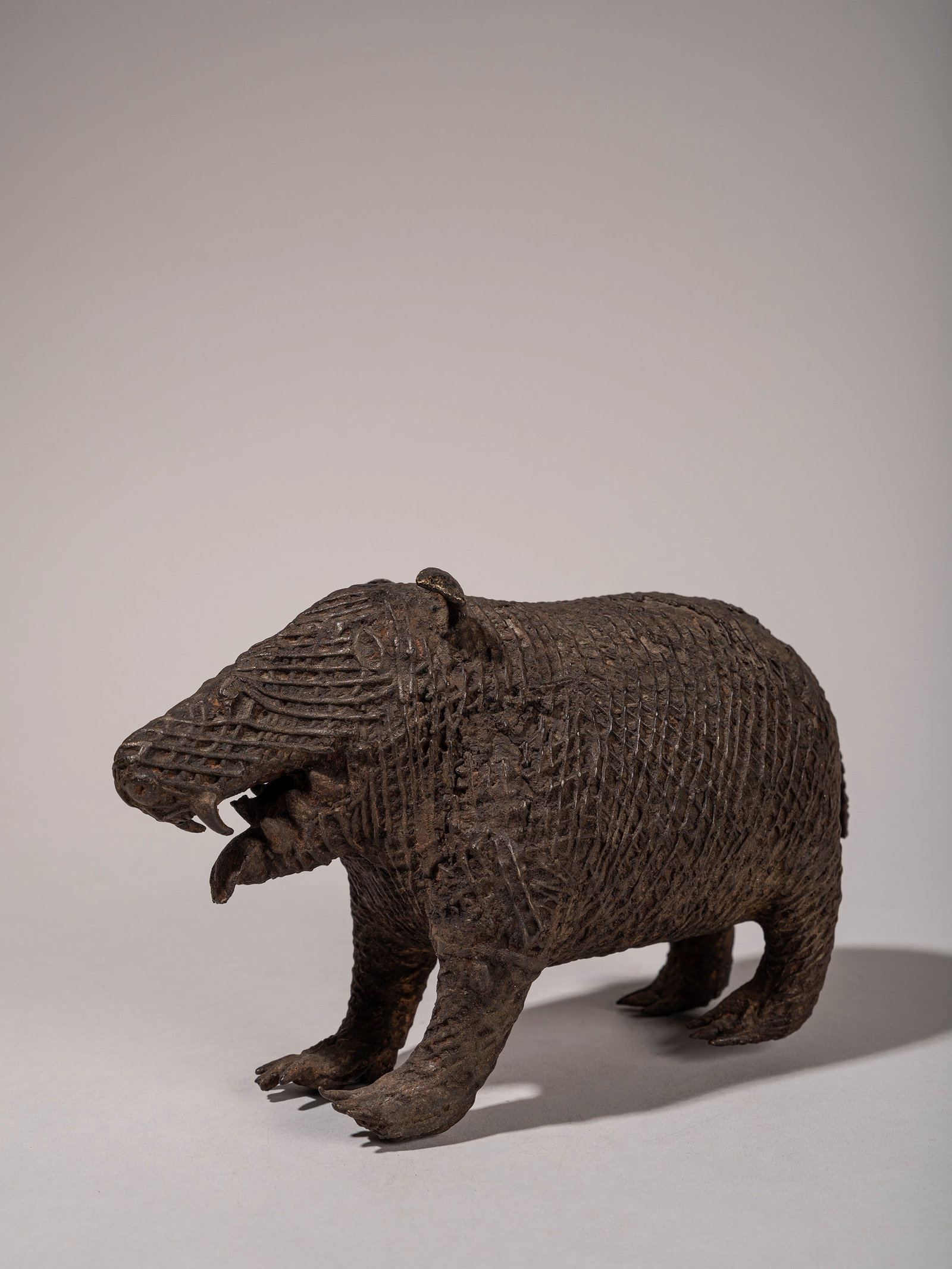 A ZOOMORPHIC KOND BRONZE FIGURE, India, 19th/20th century (1 of 4)
