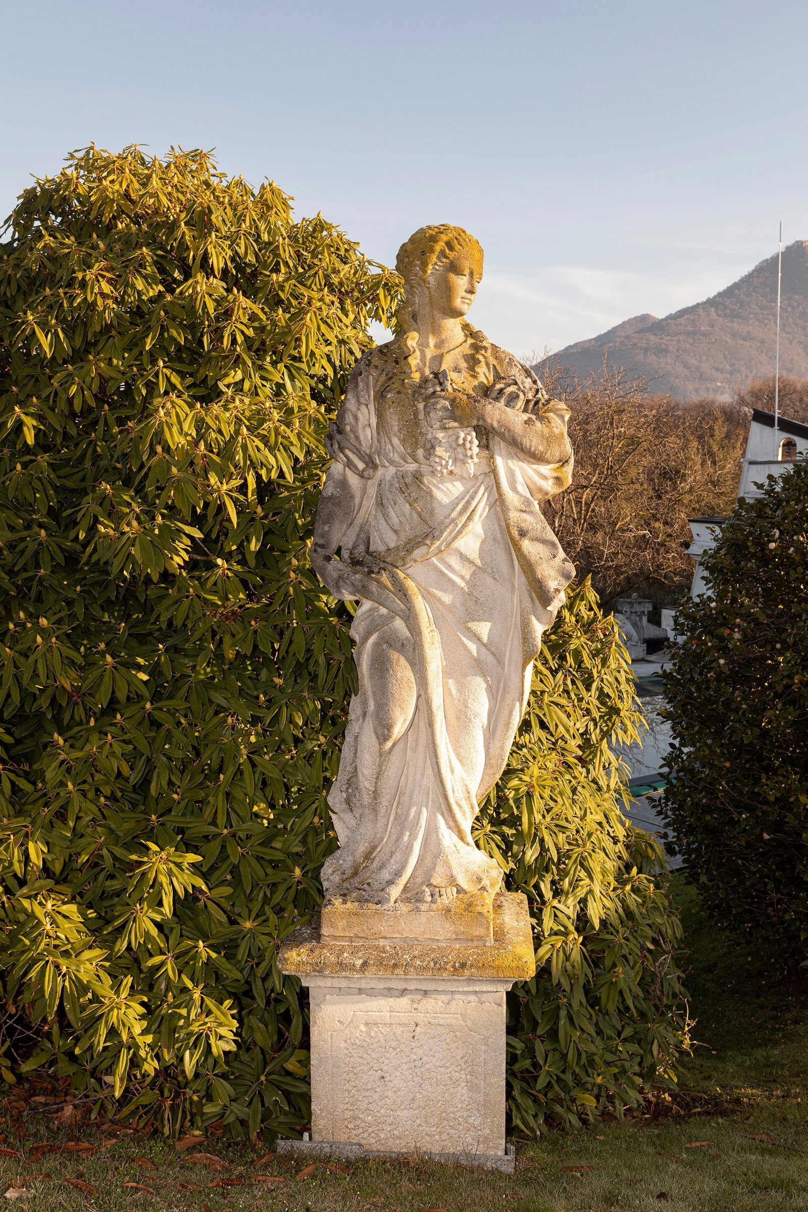 §A VICENZA STONE SCULPTURE DEPICTING FLORA, 19th century: h cm 177 Depicted standing, holding garlands and flowers in her arms, an allegory of Spring (Pedestals not included).This lot will not be on public view during the exhibition. Please contact the aucti