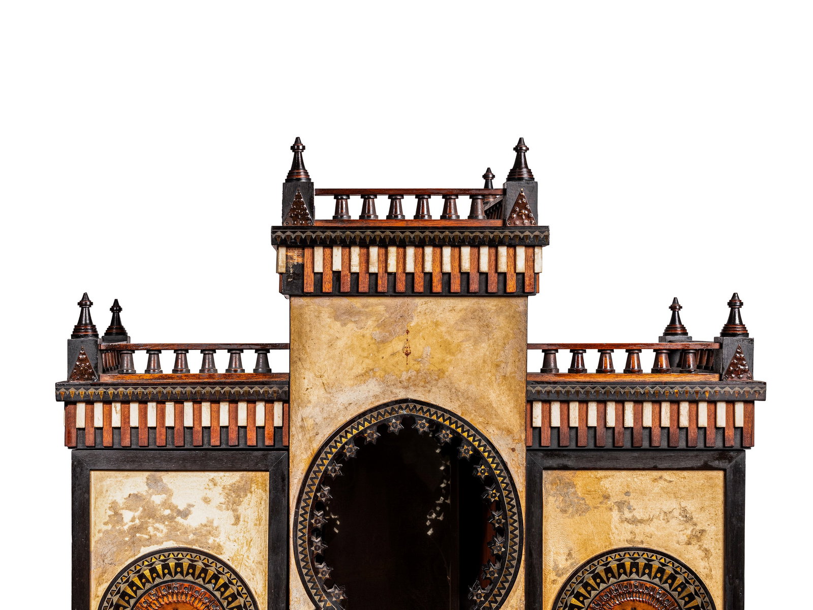 Carlo Bugatti(1856 - 1940) AN IMPORTANT INLAID WOOD AND HAND-PAINTED VELLUM MOSQUÉE CABINET, 1900: h cm 184 x l cm 85 x w cm 40 In finely worked ebonised wood, the cabinet is conceived according to a refined Moorish-inspired architectural design, characterised by pointed arches and articulated volu