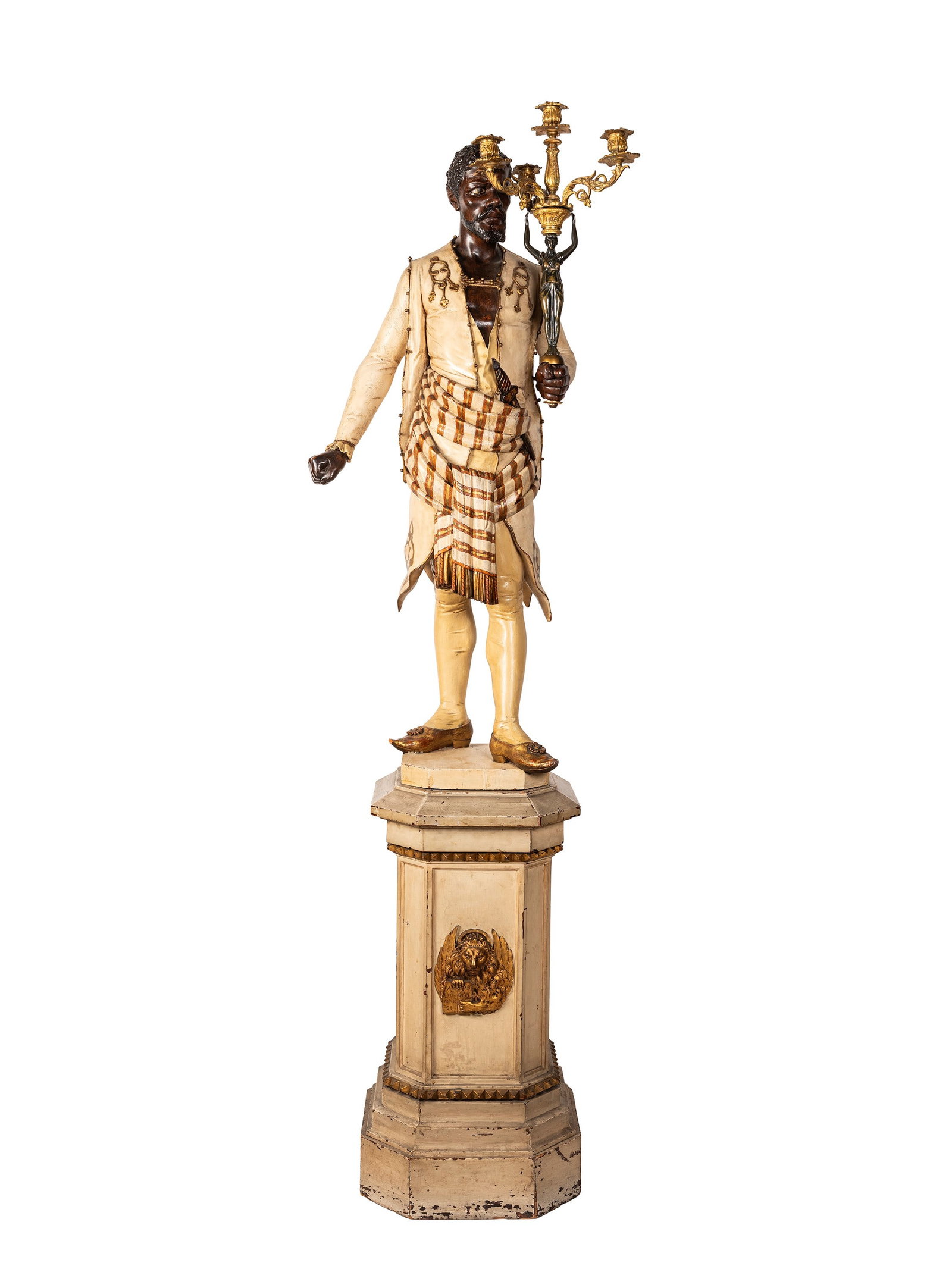 A MORO TORCH-BEARING SCULPTURE, Venice, 19th century: h tot. cm 183 cm Carved, lacquered, and polychrome wood, it depicts a figure in an orientalist style, dressed in a cream-colored lacquered tunic enriched with gilded details and a striped drapery at t