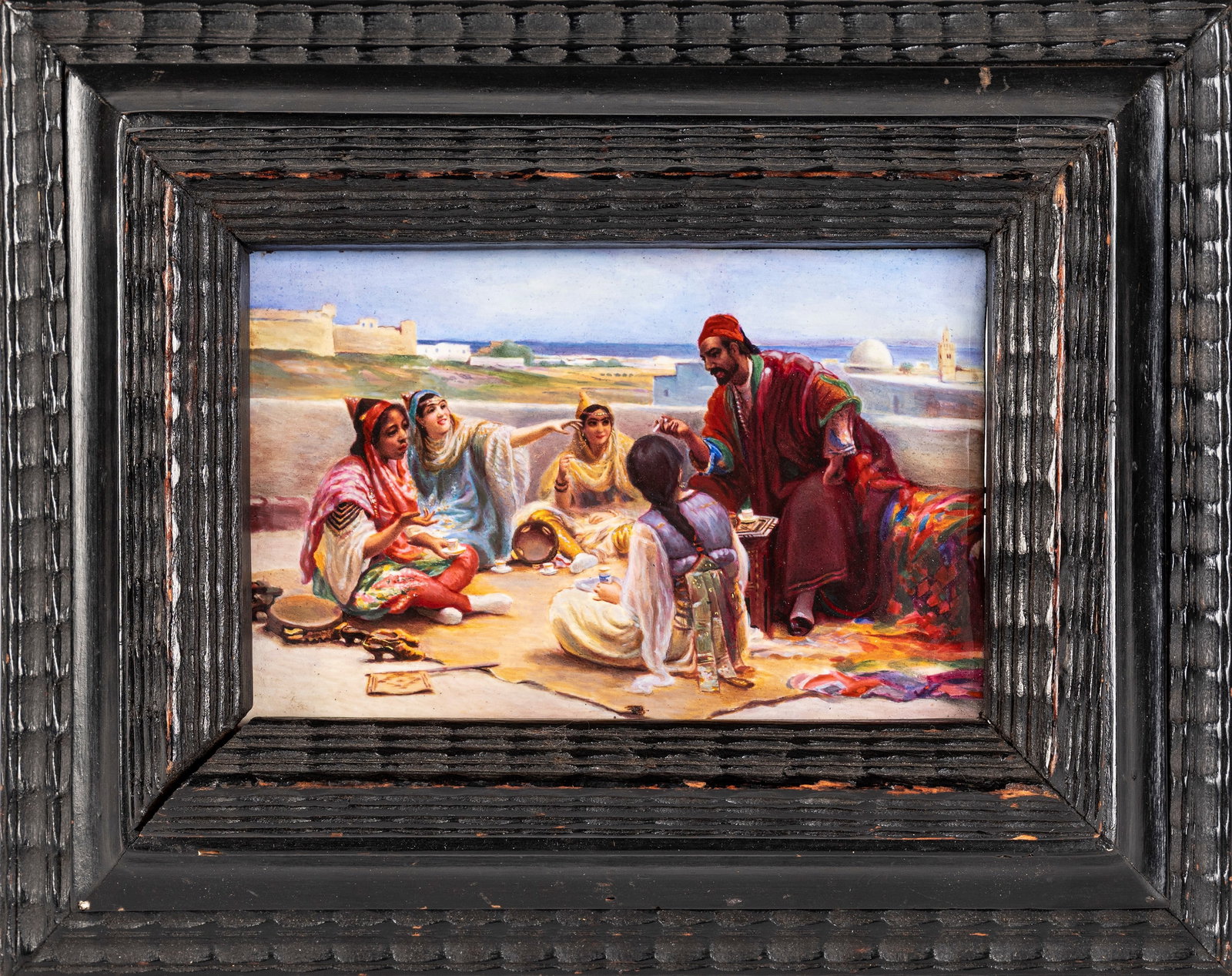 ORIENTALIST ENAMEL PLAQUE, 19th century: h cm 9 x l cm 13,5 Depicting four women and a man engaged in conversation while sipping tea on a terrace.