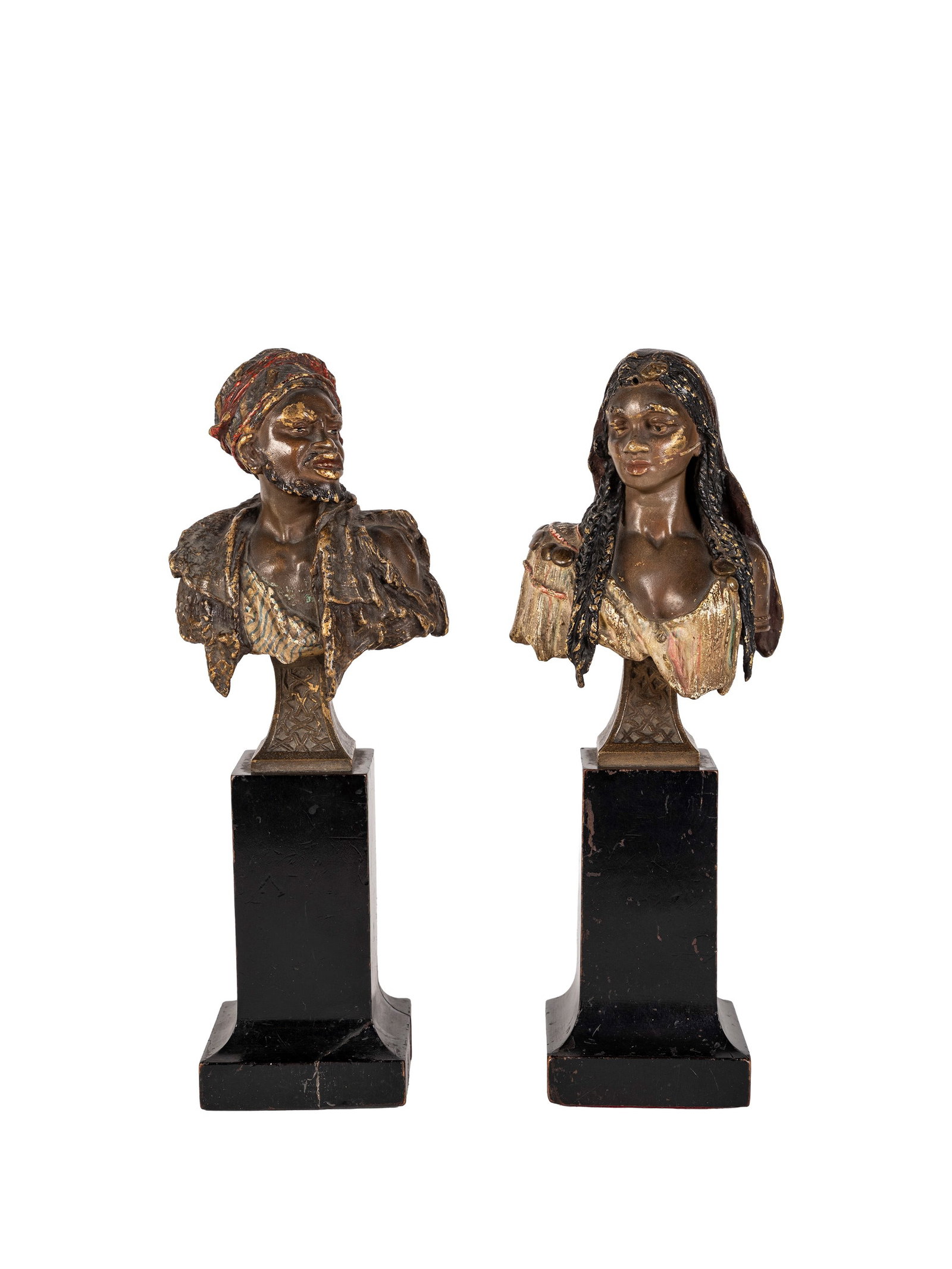 TWO ORIENTALIST BRONZE BUSTS, Vienna, 19th century: h tot. cm 22,5 Depicting a man and a woman in traditional Berber costume.