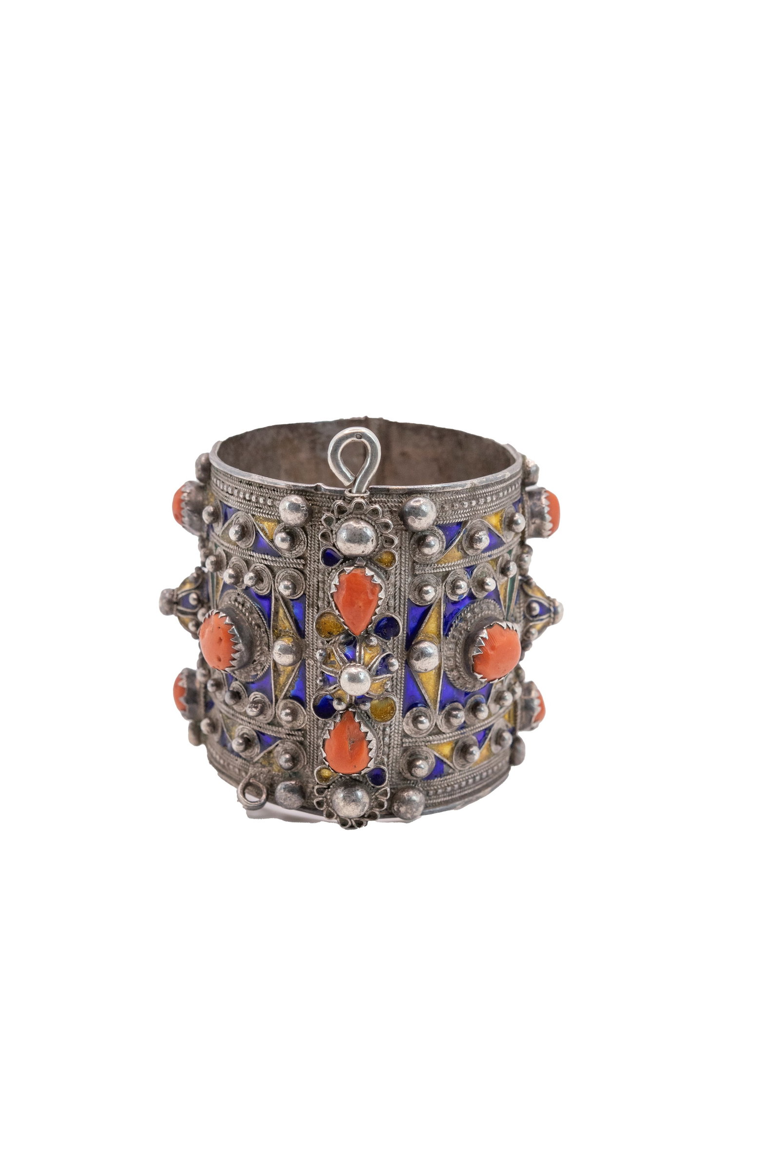 °A BERBER BRACELET IN SILVER AND POLYCHROME ENAMELS WITH SET CORALS, Algeria, early 20th century: h cm 7 x d cm 6 Weight: 156 g.