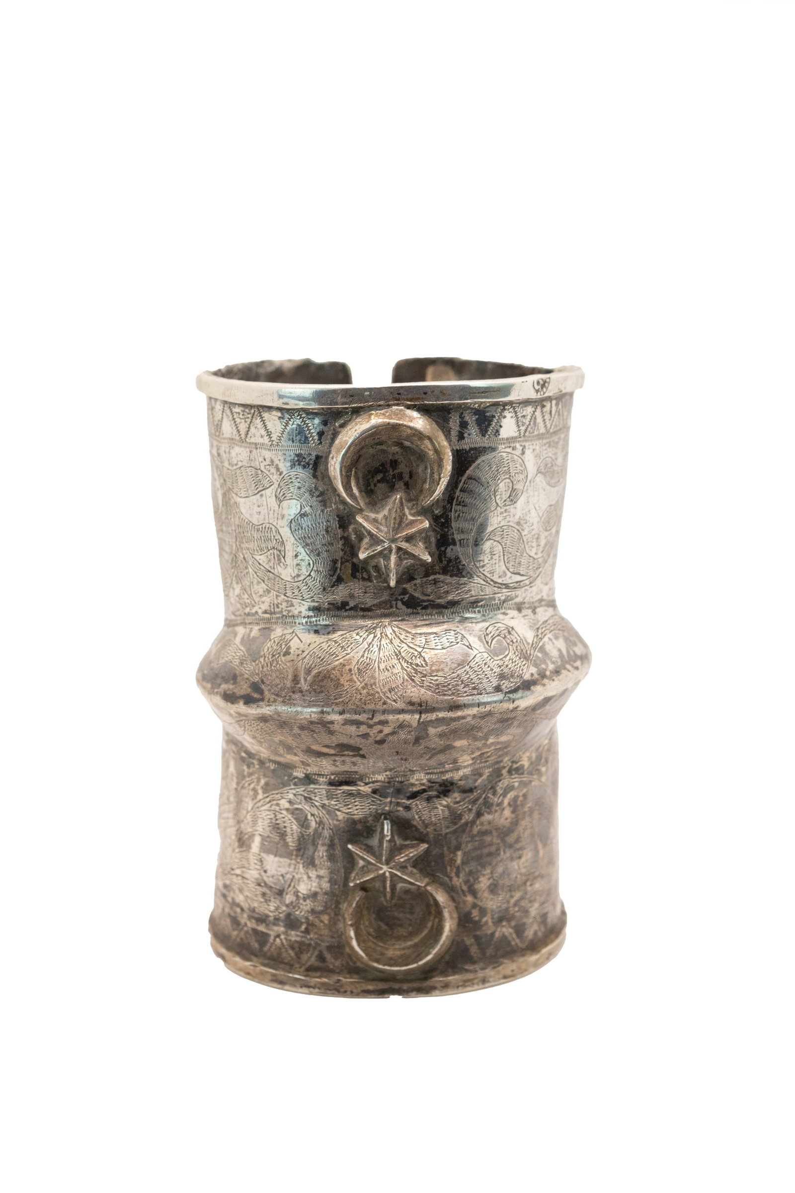 °A SILVER BRACELET, Turkey, 19th century.: h cm 13 x d cm 8,5 Decorated with crescent and star motifs. Marks along the edges. Weight 315 g.