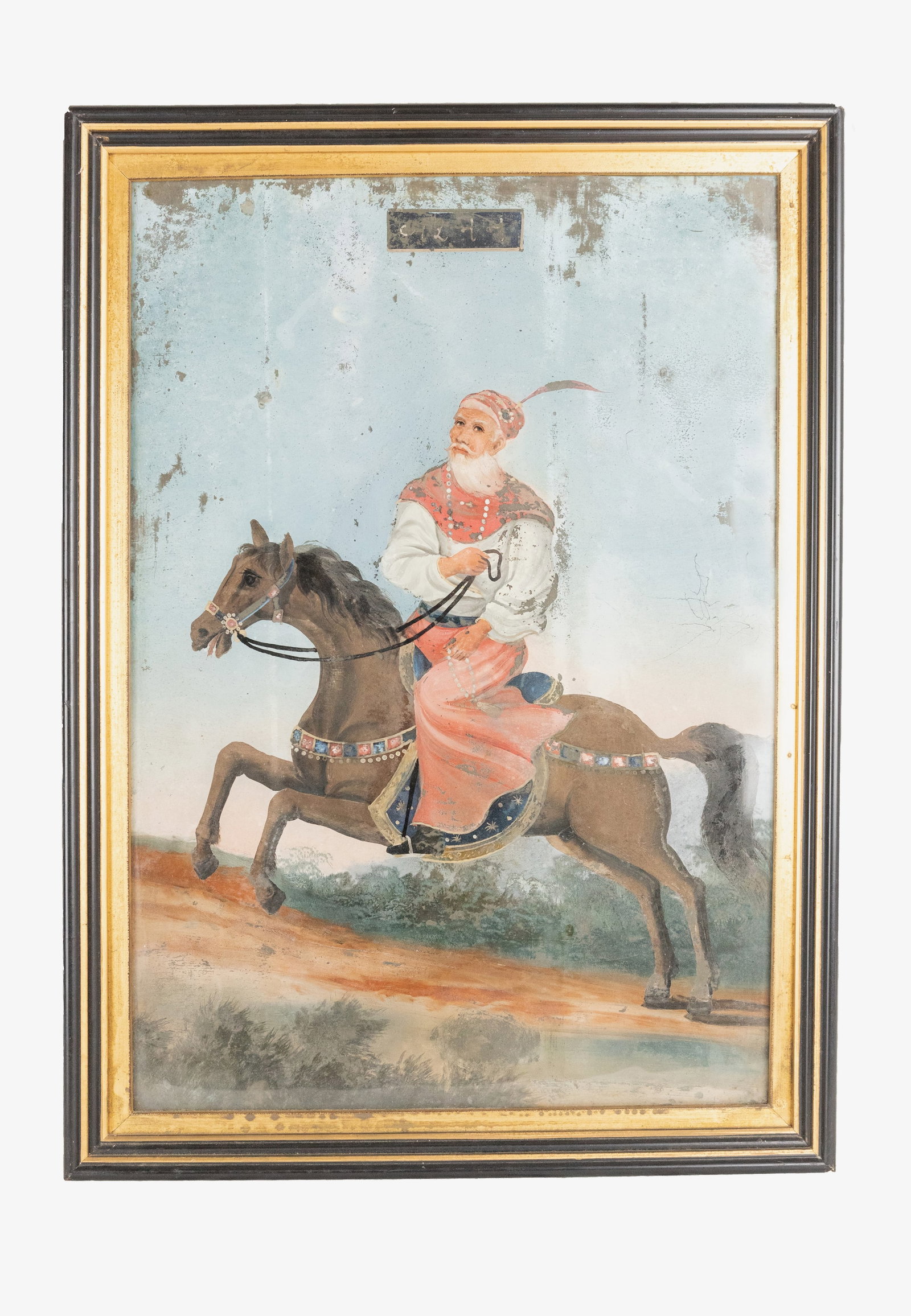°TWO VERREPAINTS DEPICTING KNIGHTS, India, 19th/ 20th century: h 50 cm x w 35 cm (each); with frame h 56.5 cm x w 41 cm (each). One signed upper centre; the other signed lower centre.