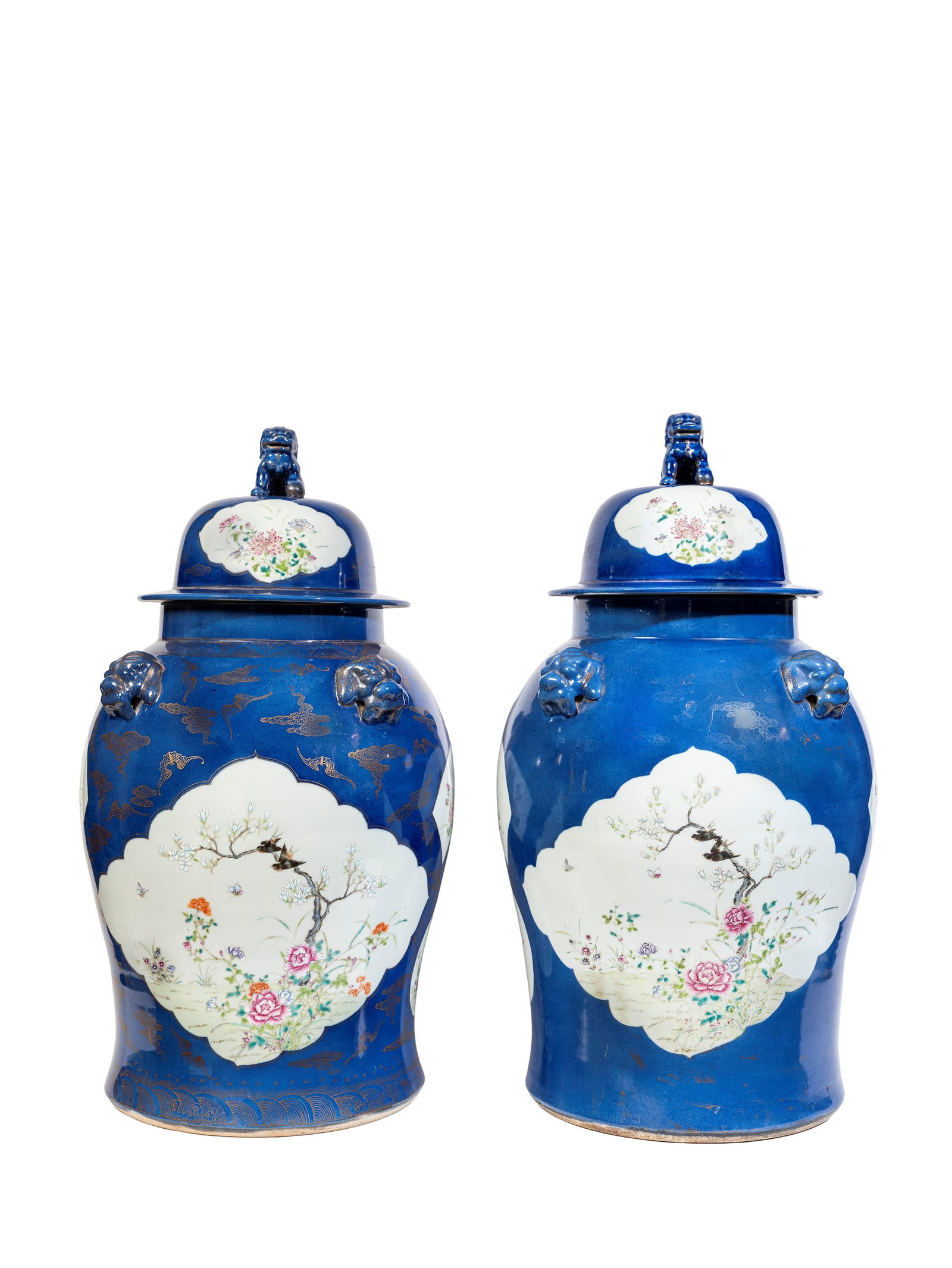 TWO LARGE POWDER BLUE PORCELAIN POTICHES, China, 20th century: h cm 69 The body, punctuated by large mask motifs, is decorated with bats and clouds in overglaze gold and glazed with large lobed panels containing floral and foliate designs. The lids, echoing the f