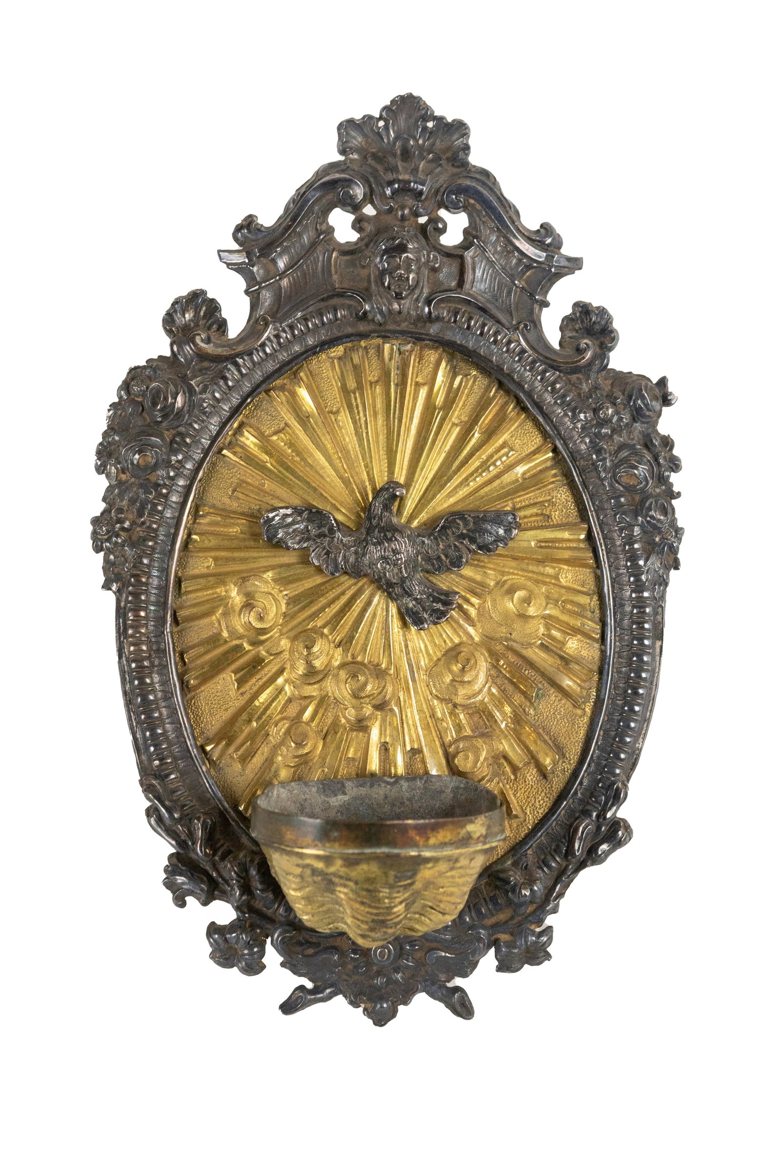 °SILVER AND GILT COPPER HOLY WATER STOUP, Rome, 18th century: h cm 26 x l cm 16 Central silver eagle.