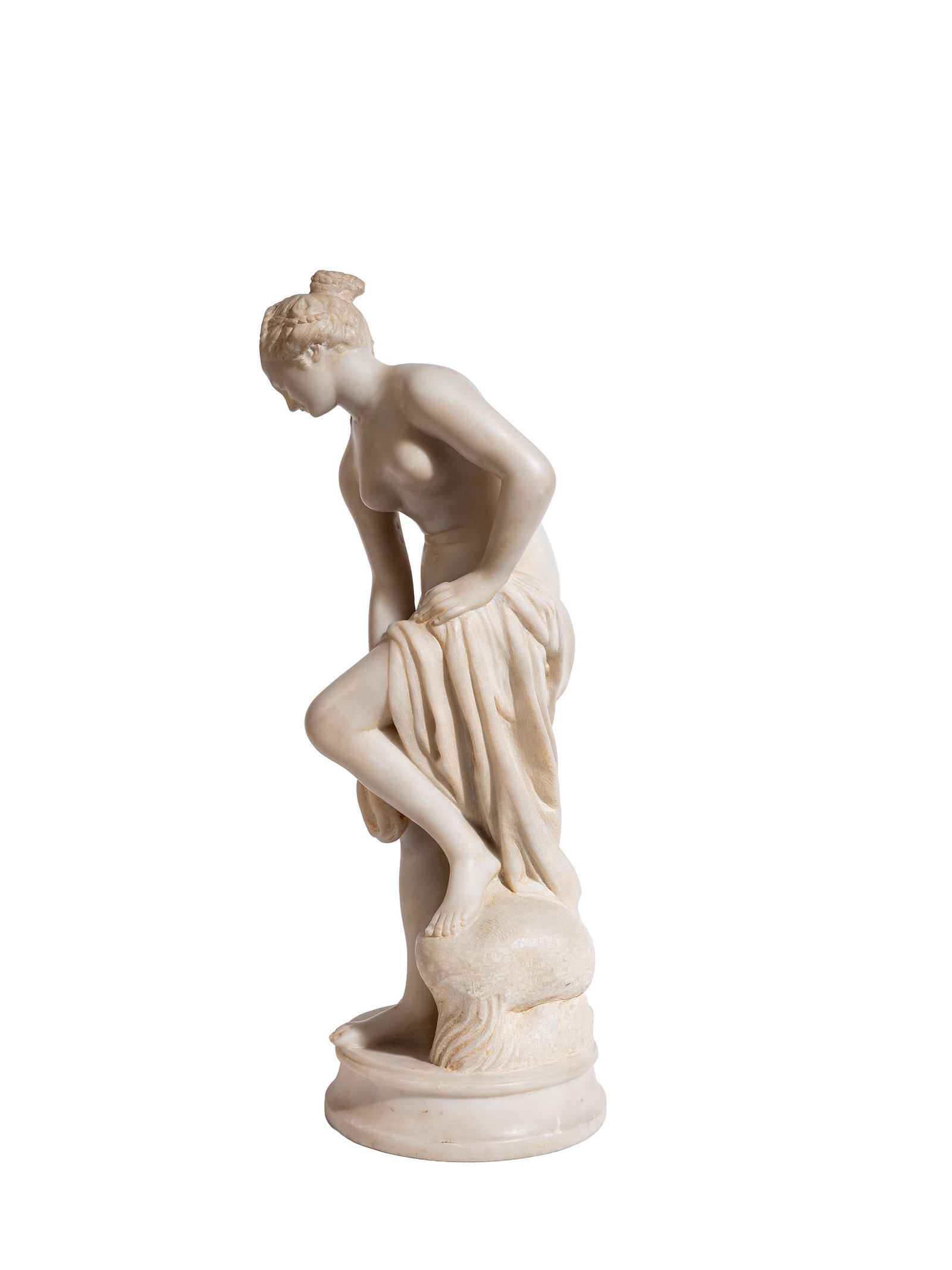 A VENUS AT THE BATH IN WHITE MARBLE, Early 20th century: h cm 47,5 From the celebrated model by Christophe-Gabriel Allegrain.