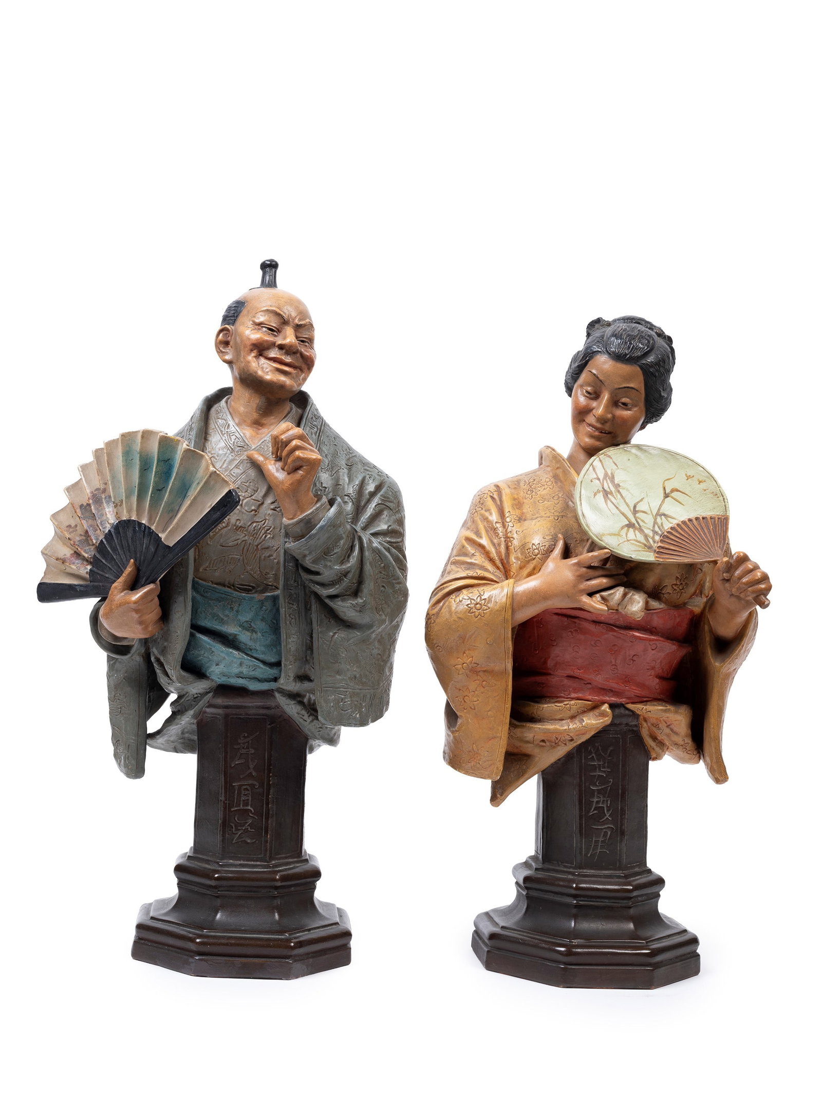 A PAIR OF POLYCHROME TERRACOTTA SCULPTURES, Early 20th century (1 of 3)