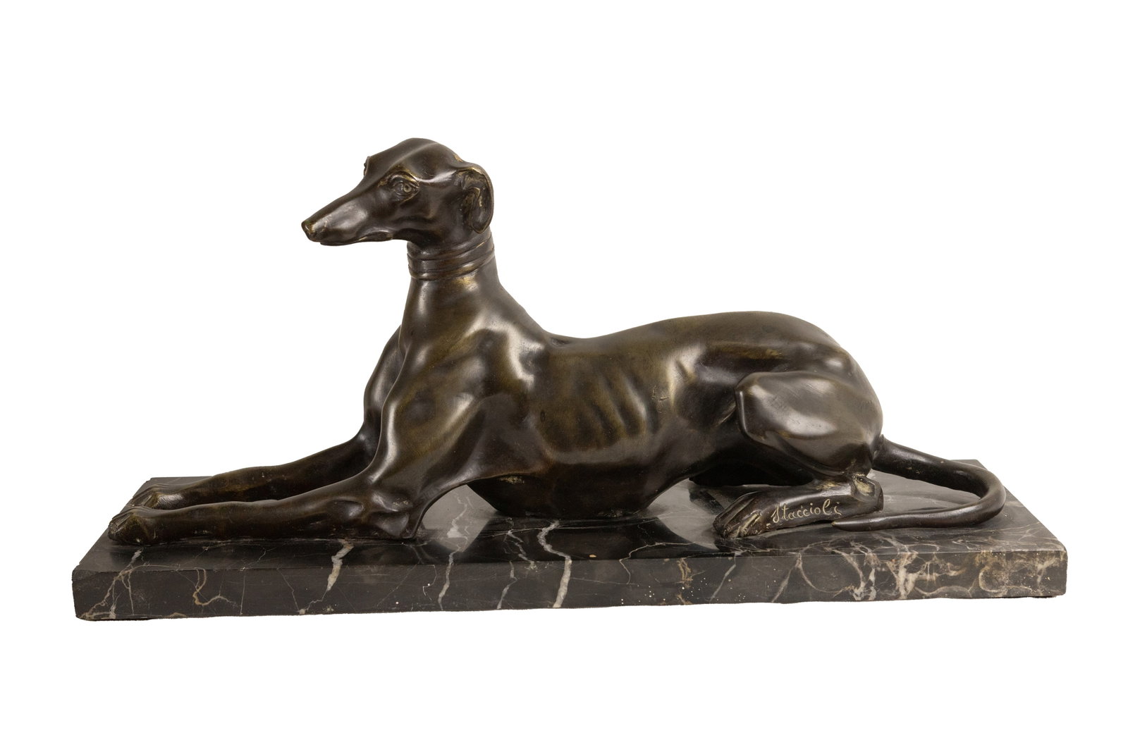 A °BRONZE SCULPTURE DEPICTING A GREYHOUND ON A MARBLE BASE, The 20th century: h cm 19 x l cm 40 x p cm 12 Signed on the hind leg Staccioli.