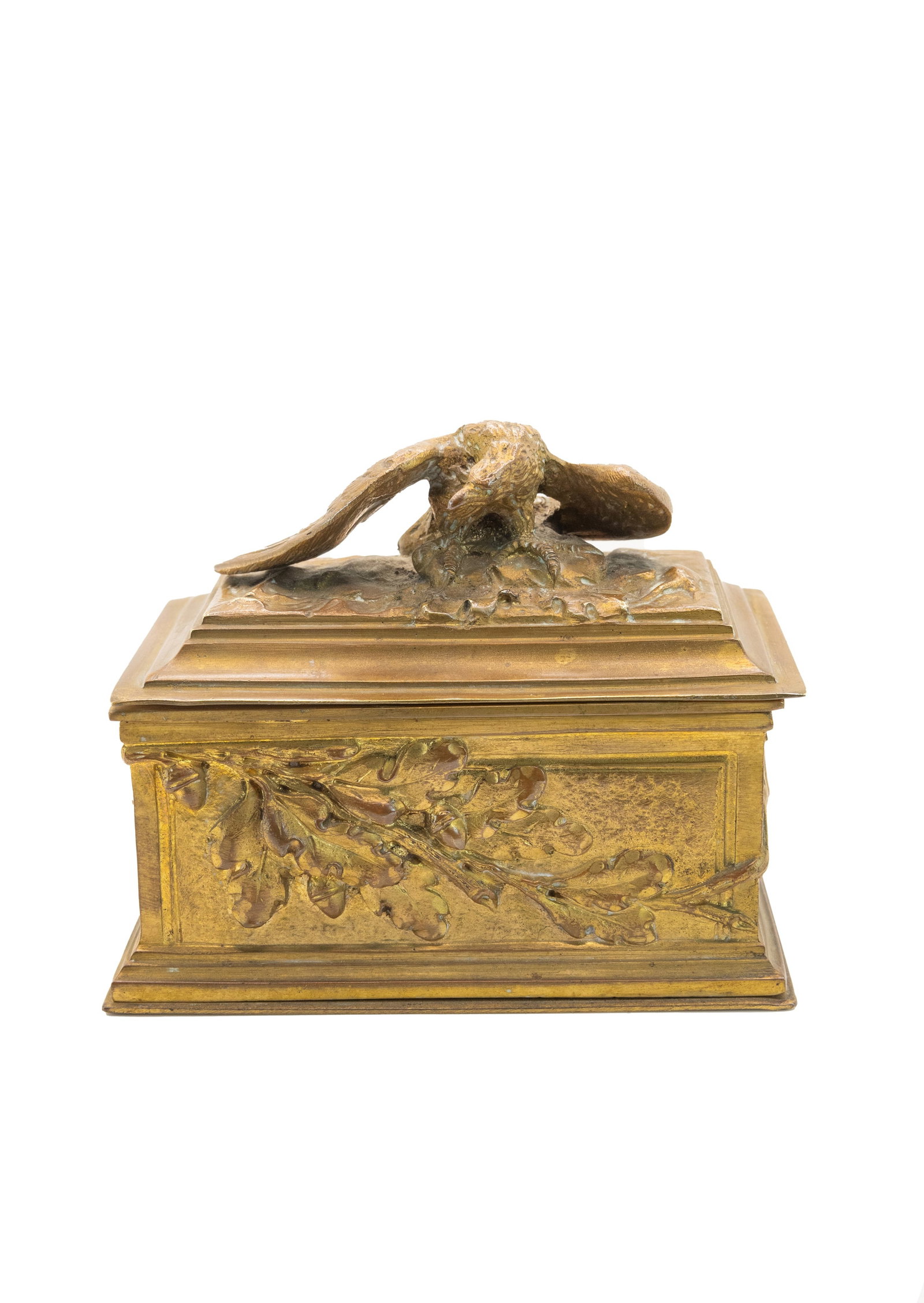 °A GILT BRONZE STAMP HOLDER, The 19th century: h cm 10 x l cm 11,3 x p cm 6,5 Handle in the form of an eagle; side decoration with oak branches and acorns. under the base inscription A. Marionnet bronzes Paris.