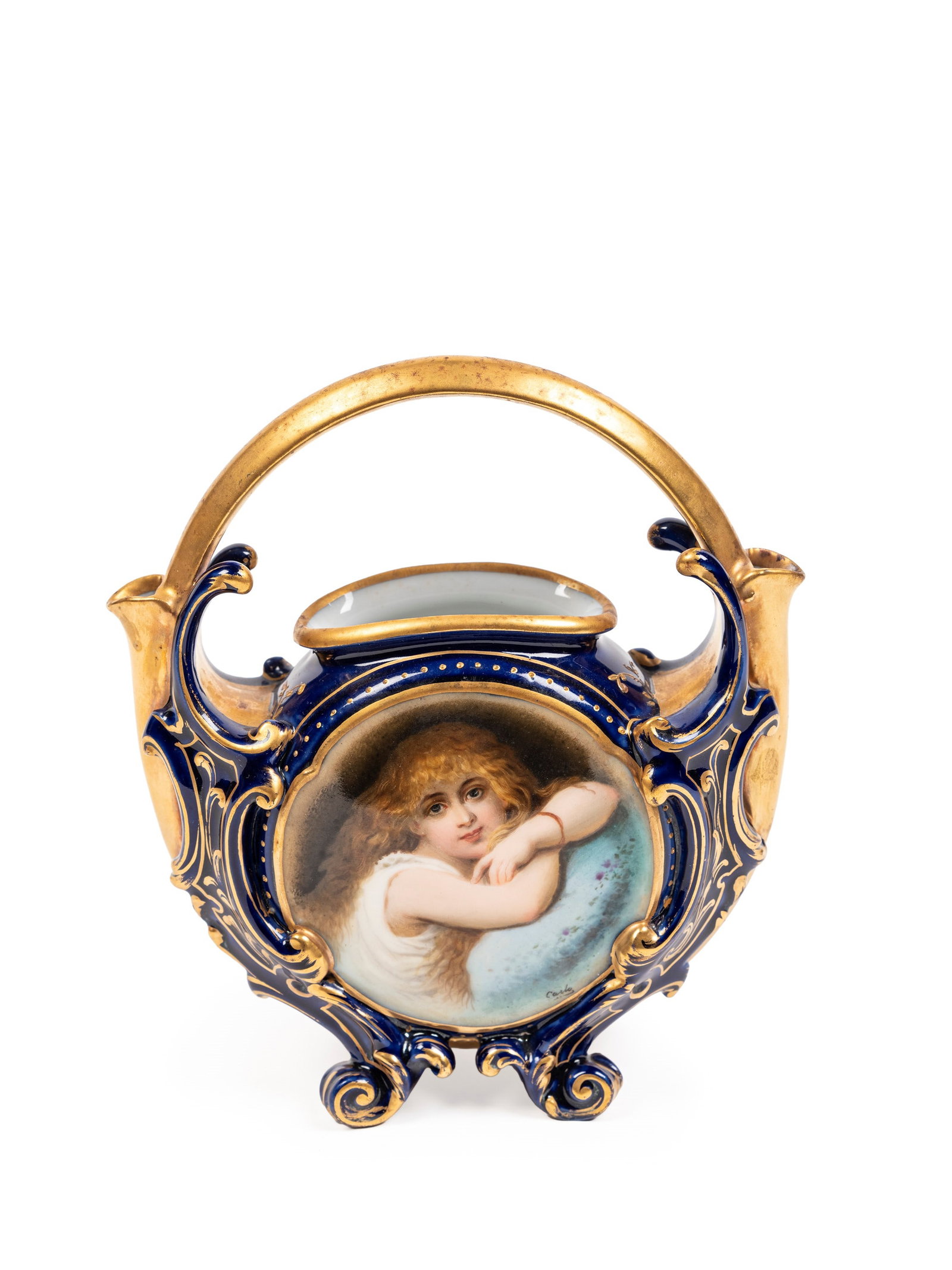 PORCELAIN CENTREPIECE BASKET, Late 19th century: h cm 16 Of shaped and flattened form, the piece features a globular central body supported by four fully gilt scroll feet. At the centre of the main body, within a circular reserve, is depicted a youn