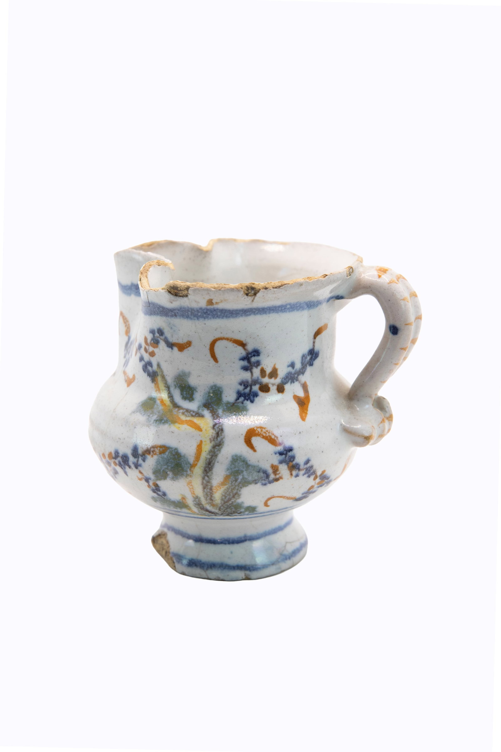°A SMALL POLYCHROME MAIOLICA EWER, Savona, late 18th century: h cm 9 x l cm 9 Mark under the base.