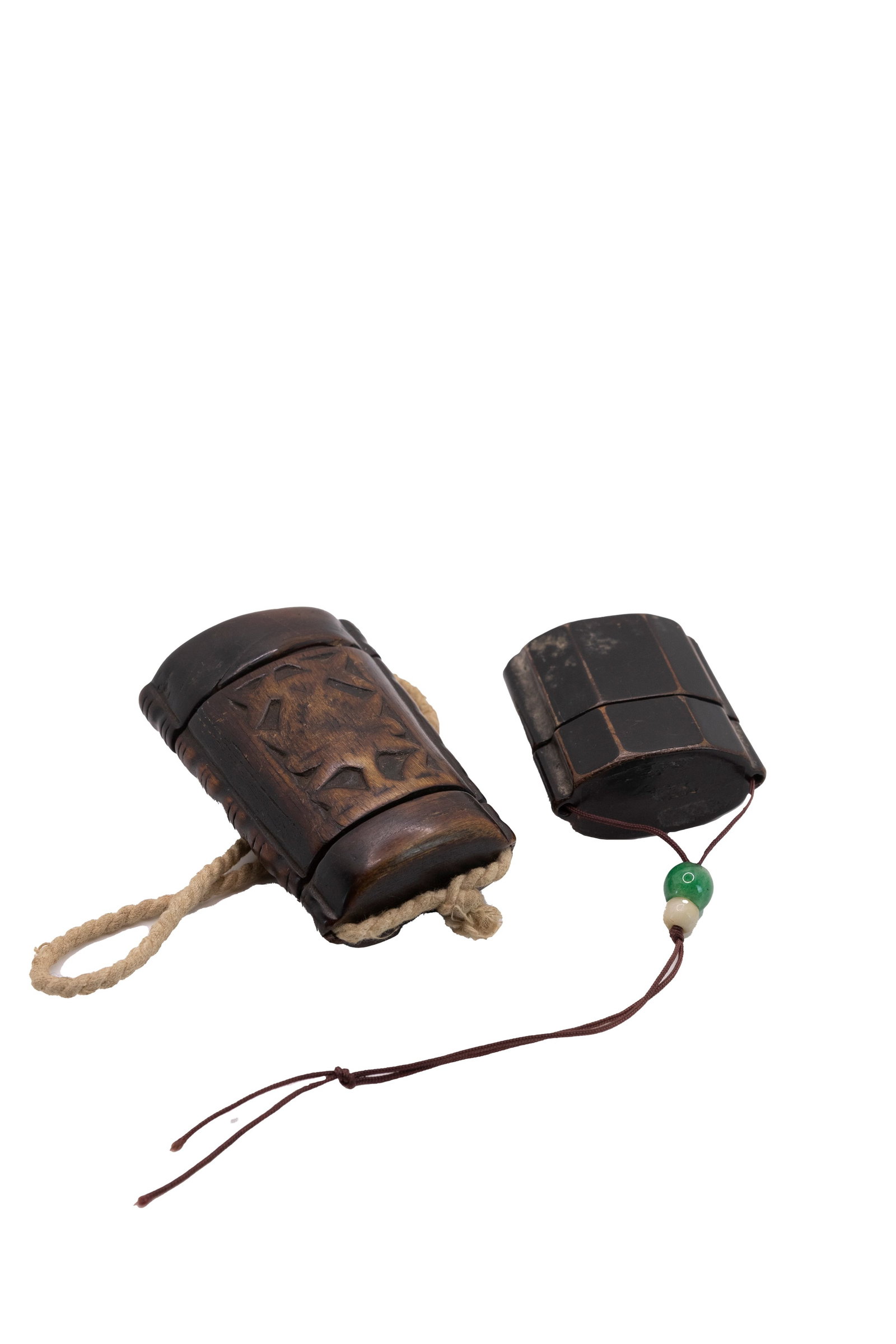 °A LOT COMPRISING TWO INR?, Japan and China, 19th century: h 8.5 cm x w 6 cm x d 3 cm (horn example); h 5.5 cm x w 5 cm x d 2.5 cm (lacquer example) One in Japanese lacquer and one in Chinese horn, Miao ethnicity