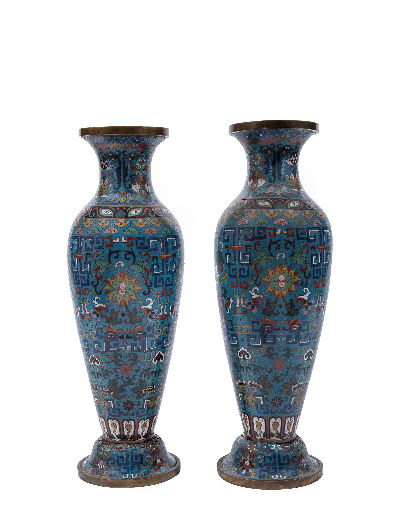 A PAIR OF CYLINDRICAL CLOISONNÉ ENAMEL VASES, China, early 20th century: h cm 44 Decorated with lotus flowers, qilong dragons, key-fret borders and stylized clouds.