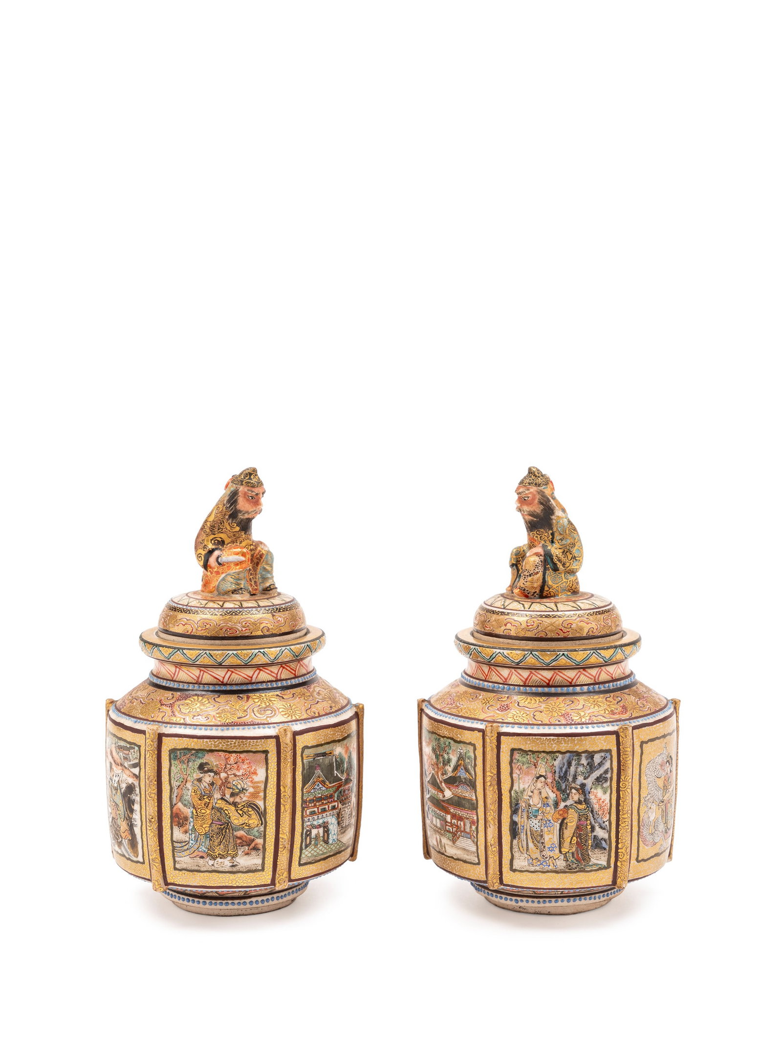 A PAIR OF SMALL SATSUMA VASES WITH LIDS, Japan, Meiji period (1868-1912): h cm 12 The body is decorated with six rectangular panels on a gilded background depicting palace and Japanese mythology scenes; both feature a lid surmounted by a warrior figure.
