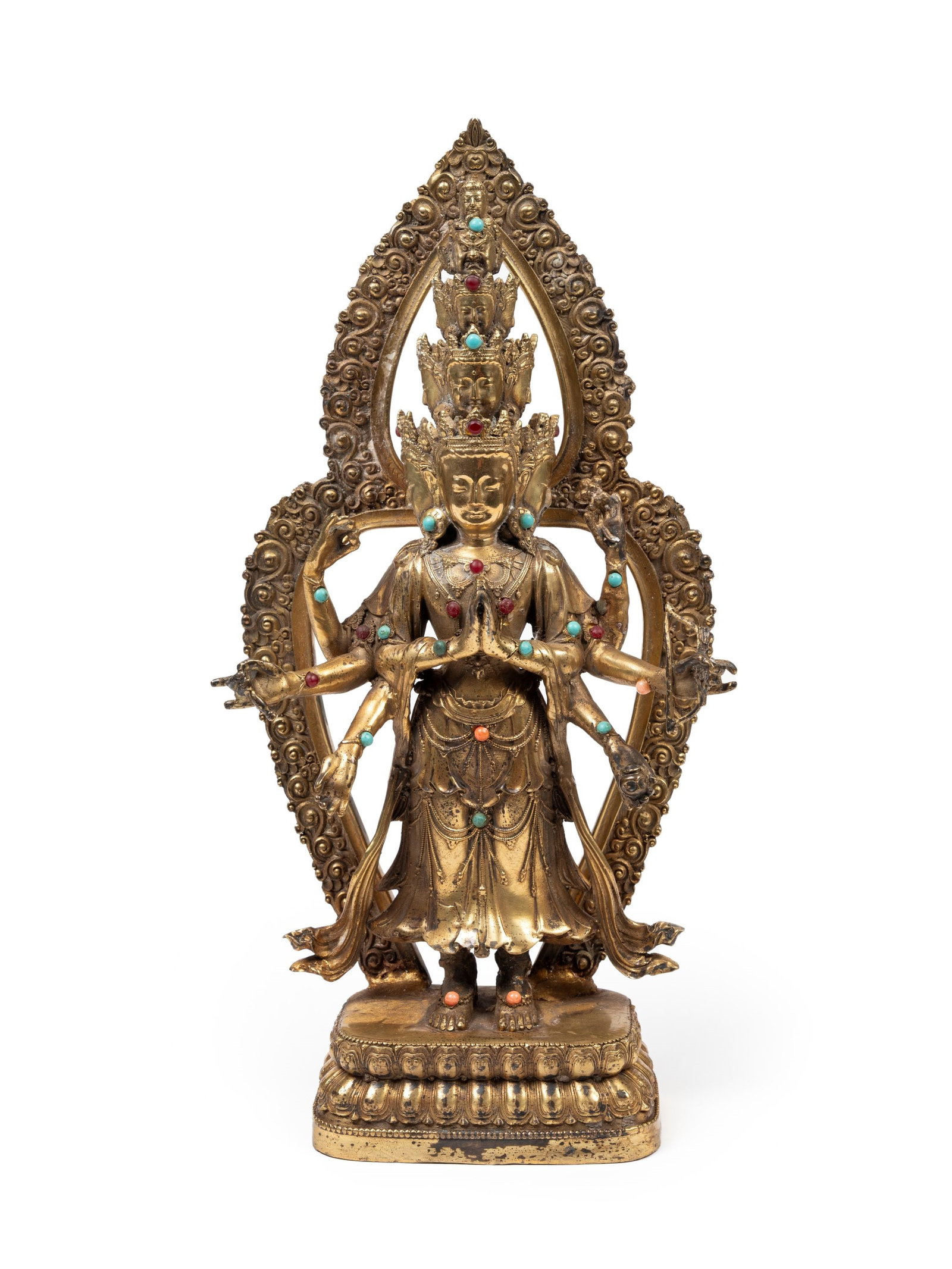 A GILT-BRONZE FIGURE OF Avalokiteshvara Ekadashamukha, China, 20th century: h cm 29 Depicting Ek?da?amukha Avalokite?vara in his Ashtabhuj? (eight-armed) form, seated on a double lotus base, adorned with hardstones.20?? ?????