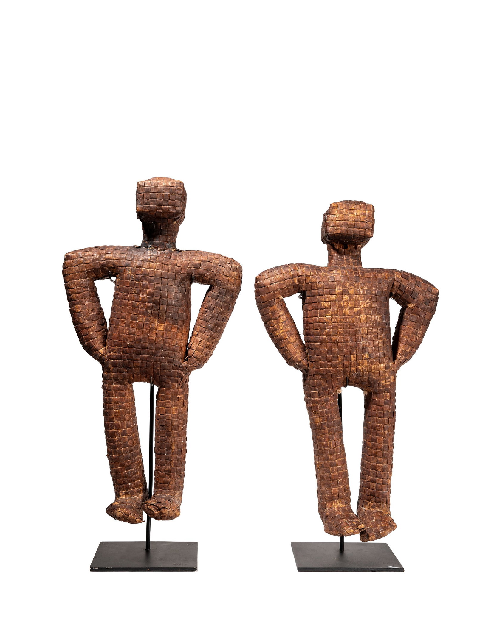 °TWO FIGURES IN WOVEN RATTAN, Sumba Islands.: h cm 46 Objects traditionally used as protective talismans in homes.