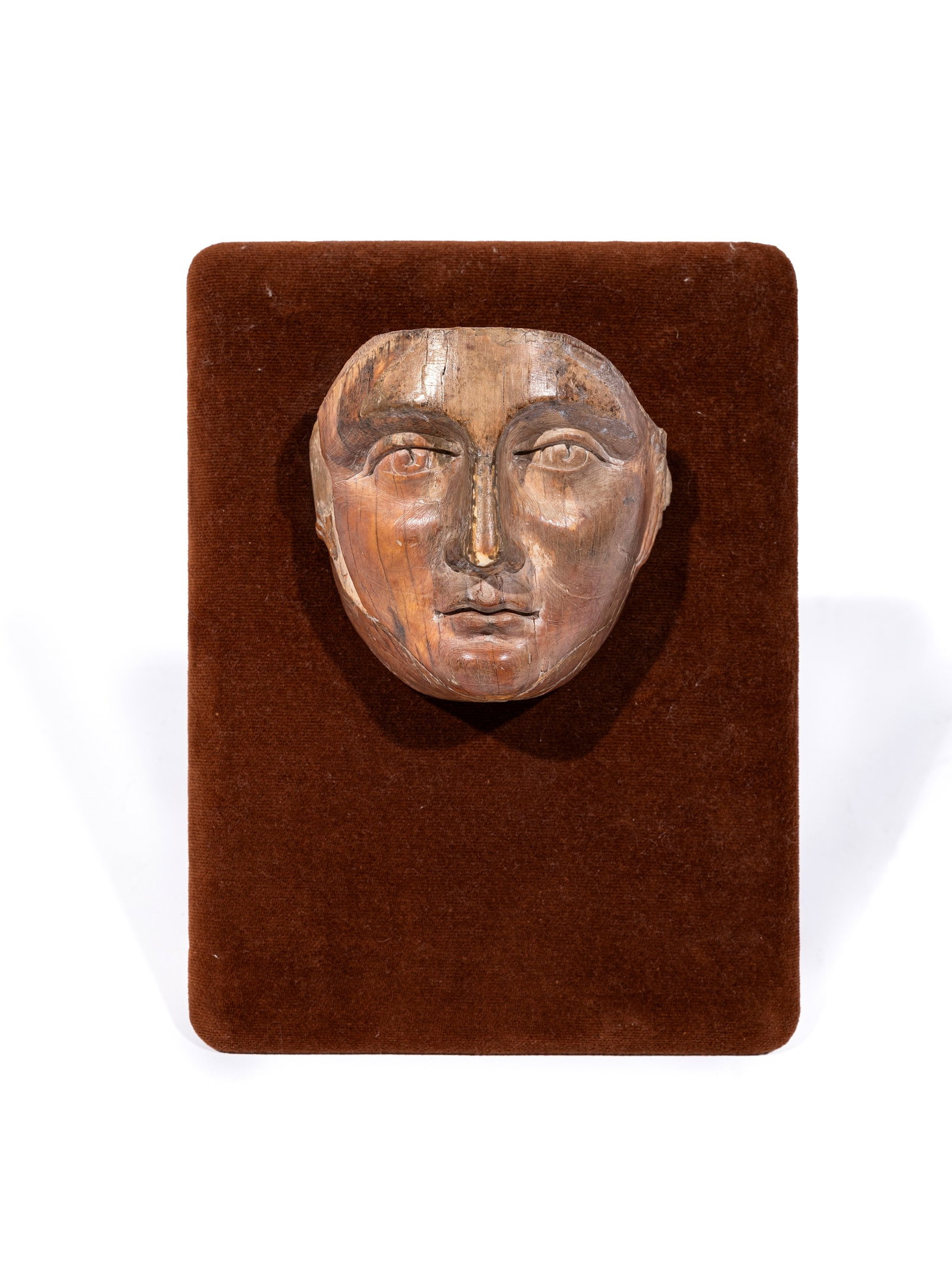 WOODEN MASK , 18th/19th century: h cm 9 x l cm 9 On a velvet base.