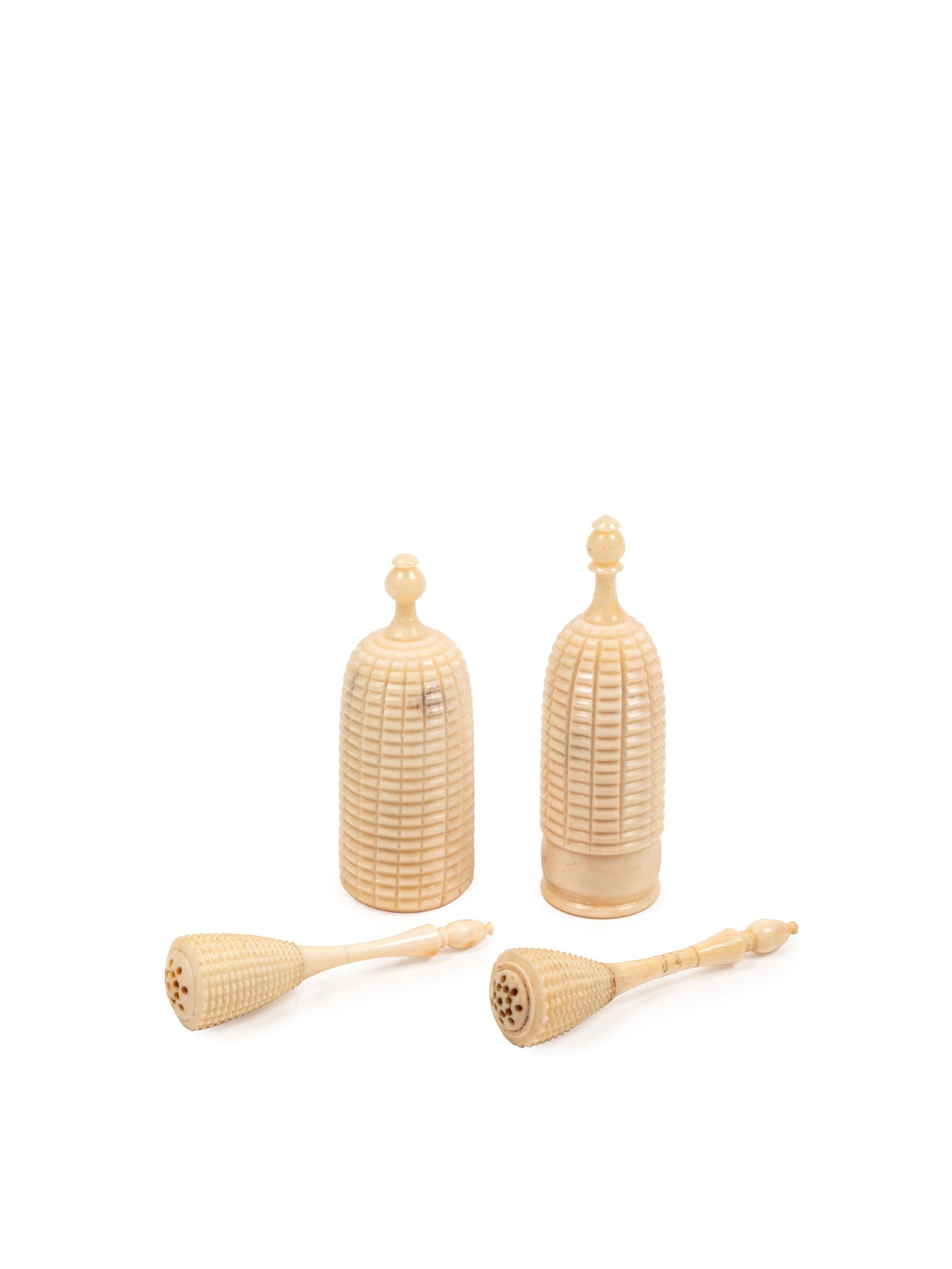?A SET OF FOUR IVORY PERFUME HOLDERS, India, Mughal, 19th century: The larger h cm 6,4 Two pairs of small containers finely worked and characterized by gadrooned decoration.The following CITES certificate is available for this lot:IT/CE/2025/FO/00755IT/CE/2025/FO/007