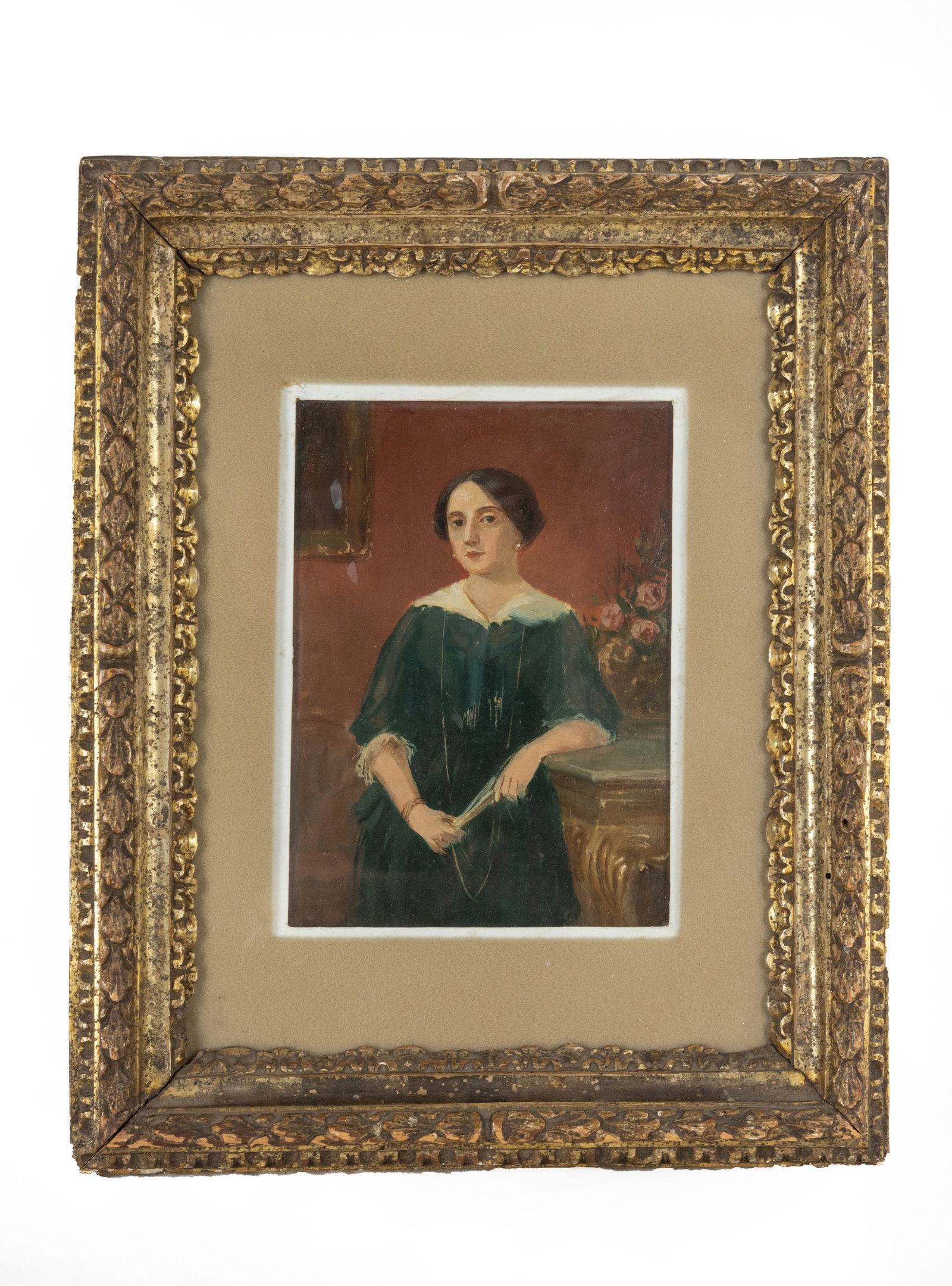 °PORTRAIT OF A WOMAN IN FRAME, 19th century: Oil on cardboard. h cm 17 x l cm 12,5; con cornice h cm 33 x l cm 26,5 Frame in carved wood with mecca gilding.