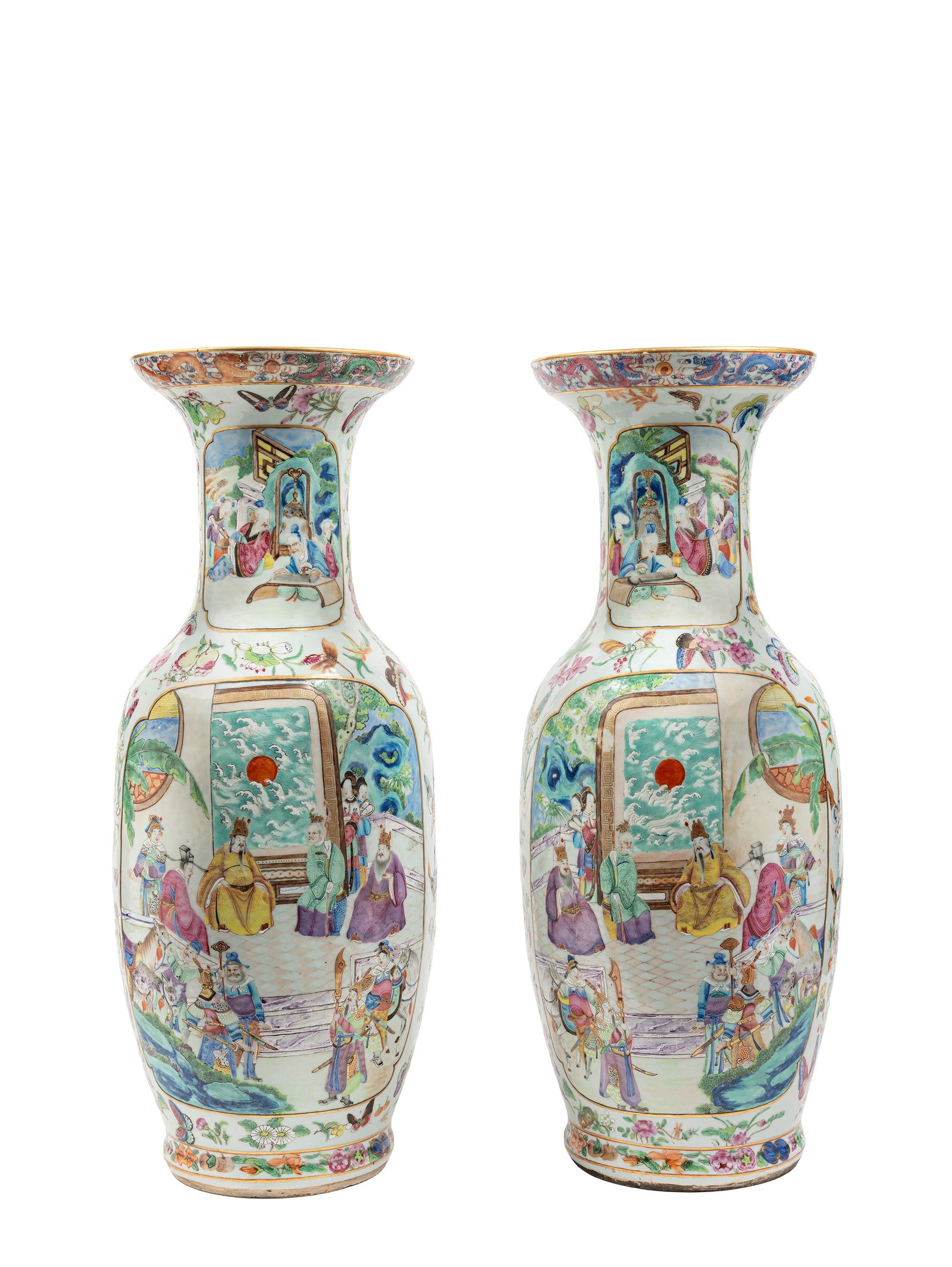 A PAIR OF LARGE 'ROSE MEDALLION' CANTON PORCELAIN VASES, China, Qing dynasty, late 19th century: h m 65 Of baluster-column form on a celadon ground, it features a rich floral decoration enlivened by butterflies and crickets. The body is divided into two large lobed reserves: one depicts a court s