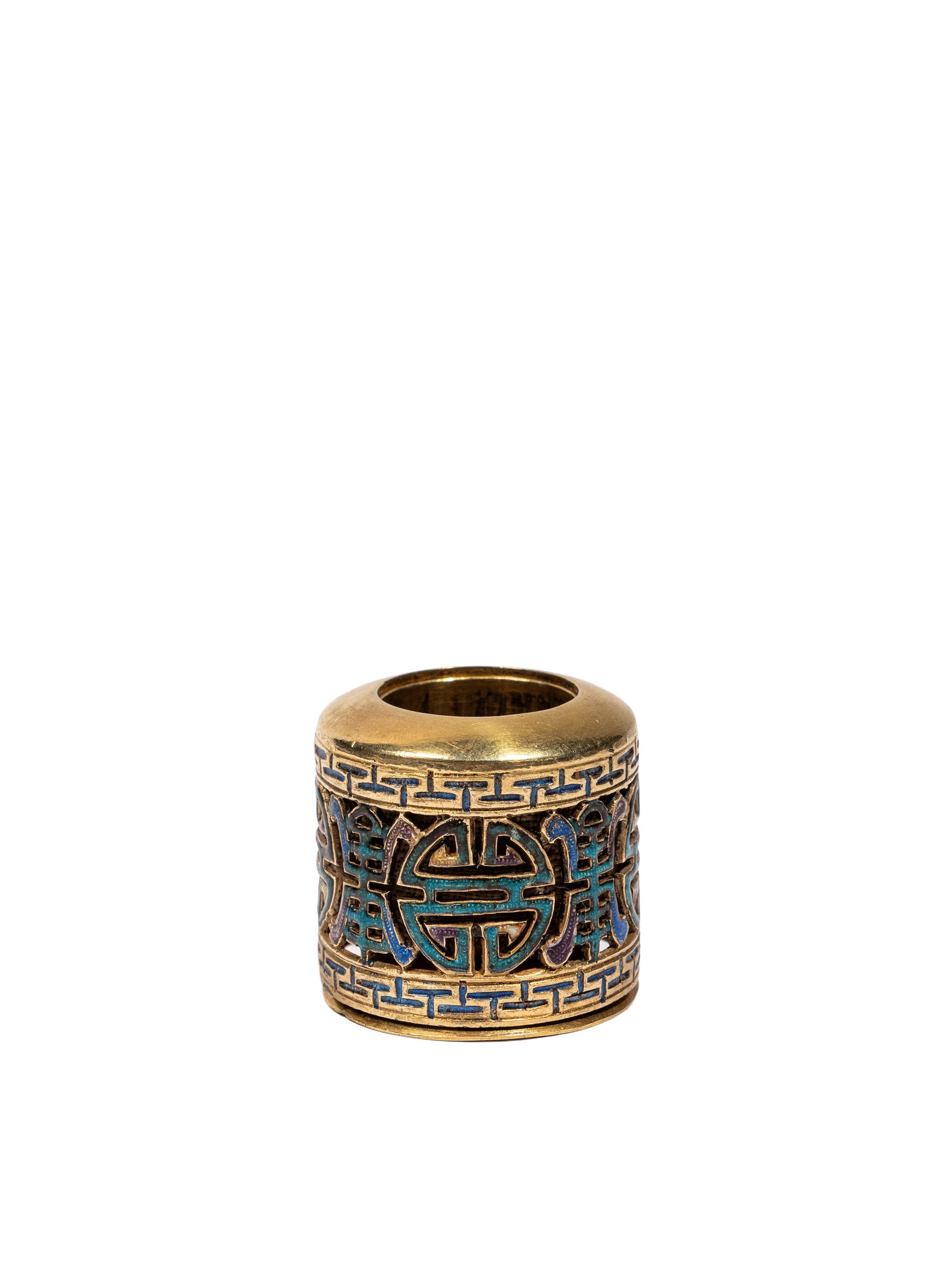 AN GILT AND ENAMELLED-BRONZE ARCHER RING, China, Qing dynasty (1644-1911): d cm 3,5Incised and pierced-carved with shou characters and key-fret motifs.Catalogue notes:Compare the examples in the Musée de l’Archerie & du Valois, accession numbers 2002.22.05, 2005.6