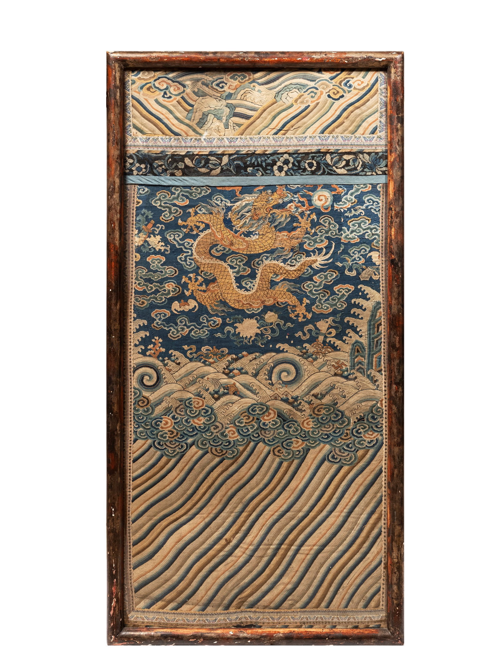 A SILK KESI PANEL, China, Qing dynasty, 18th century: h cm 103 x l cm 53 Depicting a five-clawed dragon holding the flaming pearl among bajixiang, waves, and clouds. 清18世纪 清代缂丝龙袍&#