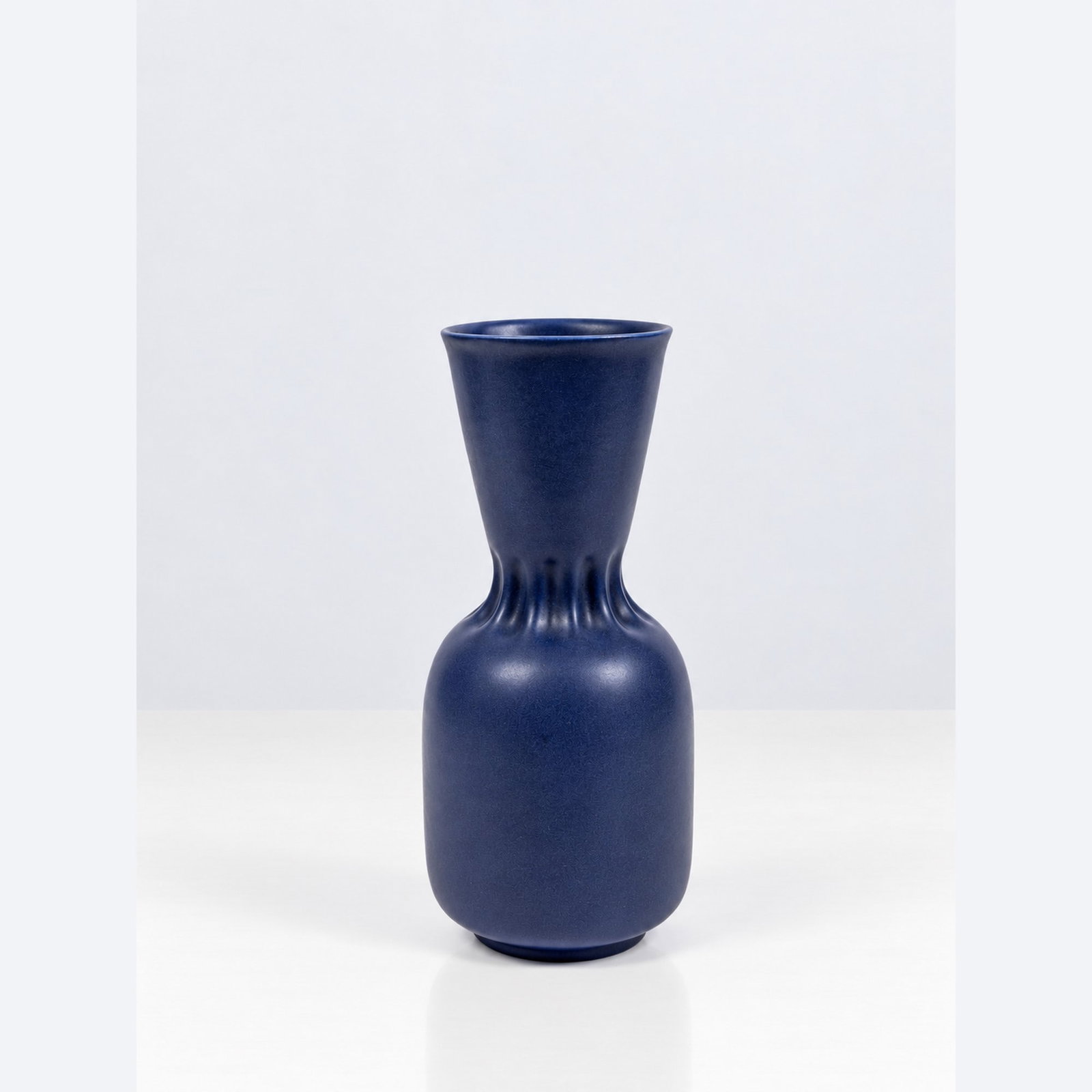 Giovanni Gariboldi (Milano 1908 - 1971), VASE, MODEL 6594, circa 1947: h cm 27 Blue glazed ceramic. Richard-Ginori mark and model number on the underside. Produced by Richard-Ginori, Italy.Catalogue note:The model is illustrated in the Catalogo Ginori, plates 2 and 32.