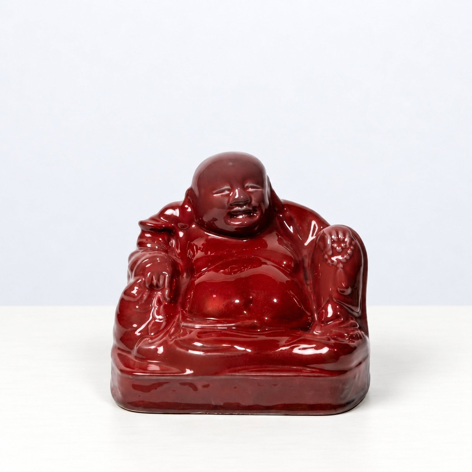 Gio Ponti (Milano 1891 - 1979), "BUDDHA 5762" SCULPTURE, circa 1930s: h cm 18 x l cm 21 x w cm 18 Cast earthenware with red celadon glaze. Manufacturer's mark, Richard Ginori, San Cristoforo, Milan, Italy.Catalogue notes:See the example published in the Catalogue of Mod