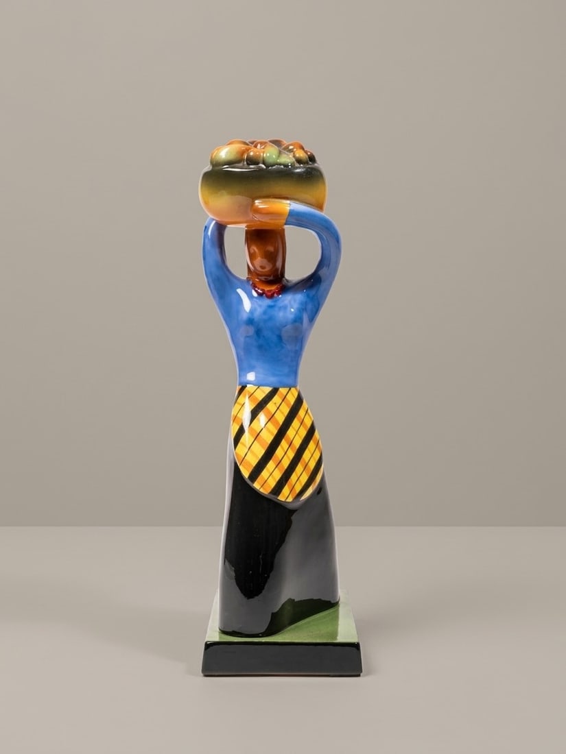Giovanni Ciangottini (Umbertide 1912 - 1988), "CANEFORA" SCULPTURE (GIRL WITH BASKET), circa 1930s: h cm 36,4 x l cm 10,7 x w cm 15,4 In glazed terracotta, signed, manufactured by Ceramiche Rometti Umbertide, Italy.Catalogue notes:See the example published in Marinella Caputo and Enrico Mascelloni
