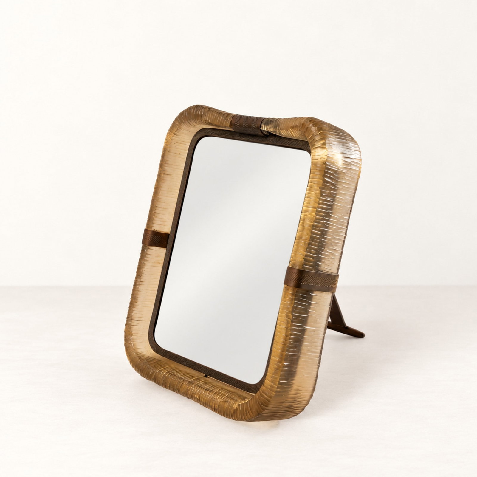 Carlo Scarpa (Venezia 1906 - 1978), "BATTUTI" SERIES FRAME, circa 1940s: h cm 28 x l cm 23 Brass and glass. Stamped on the support. Venini production, Murano, Italy.Catalog notes:Carlo Scarpa, Visions in Glass 1926-1962 a European Private Collection, Christie's.