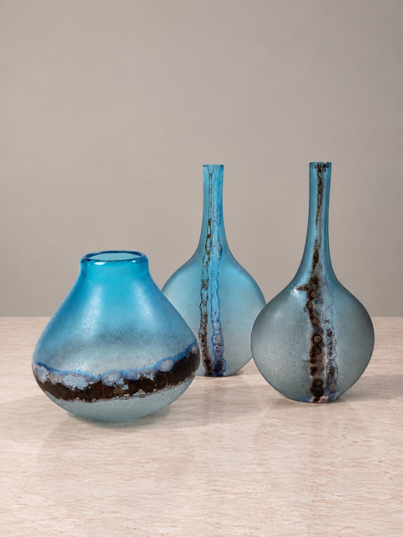 Alfredo Barbini (Venezia 1912 - Venezia 2007), VASES, circa 1970s: h max cm 32 Set of three. Double-layer blown glass with acid-etched finish and polychrome oxide decoration. Signed to the base, retaining the original manufacturer's labels. Produced by Barbini,