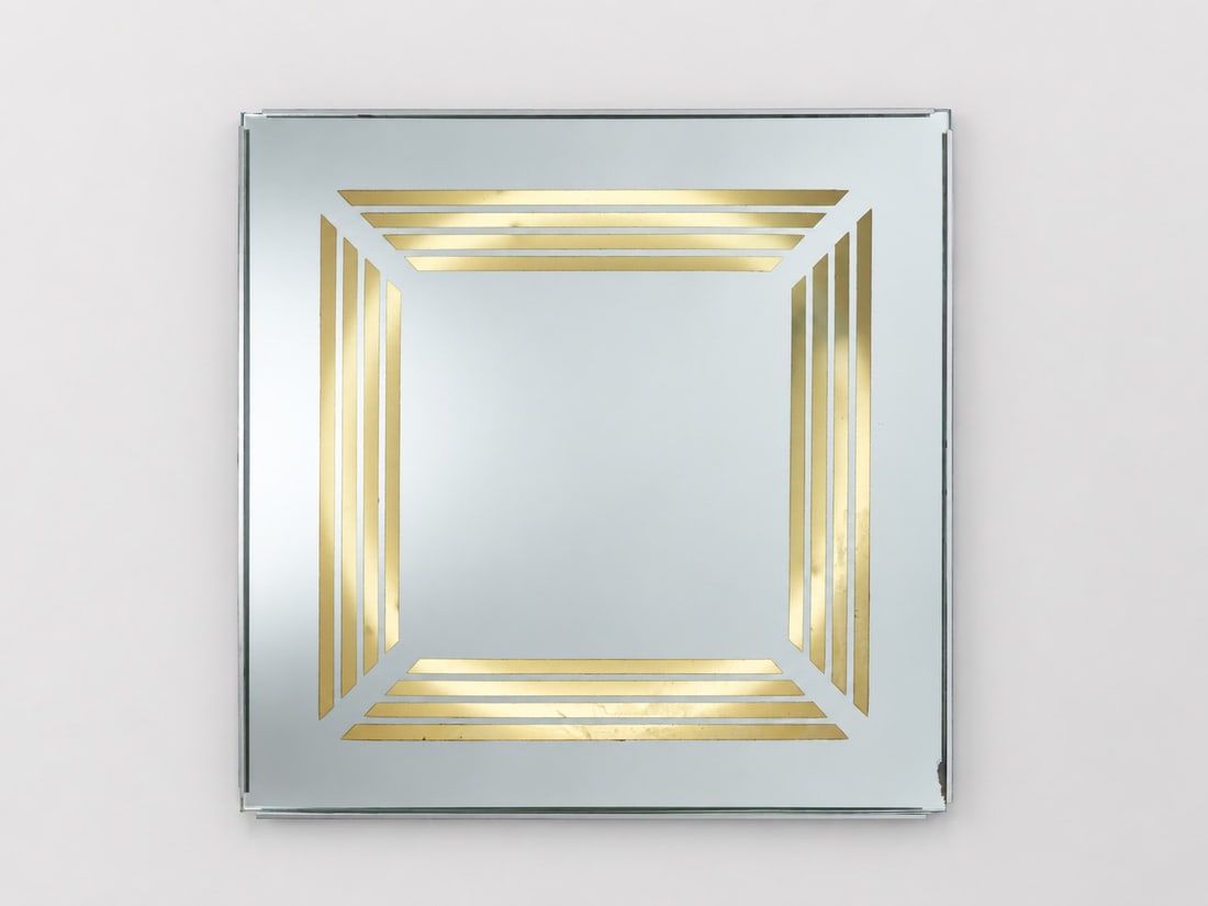 Gianni Celada (Milano 1935 - 2023), ILLUMINATED WALL MIRROR, circa 1970s: l cm 49 x h cm 49 Mirror with gilt screen-printed decoration, metal frame and integrated lighting system. Fontana Arte edition, Italy.