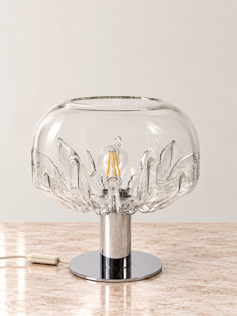 Toni Zuccheri (San Vito al Tagliamento 1936 - 2008), ZINIA TABLE LAMP, circa 1972: h cm 32 x d cm 30 Murano glass and chromed metal. VeArt production, Italy.