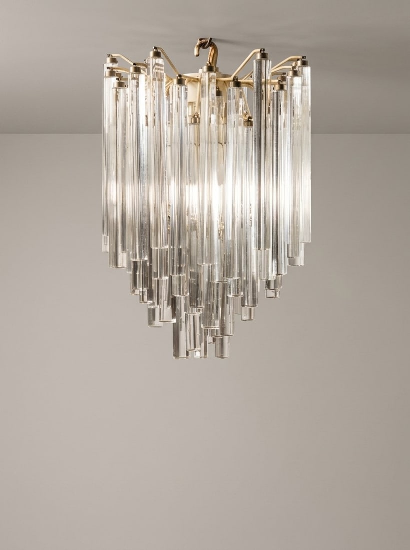 VENINI, PENDANT LAMP, circa 1970s: h cm 60 x l cm 42 x p cm 37 "Trilobo" glass elements and metal stem. Signed to the metal stem: "Venini s.a.s. Murano Made in Italy". Produced by Venini, Murano, Italy.