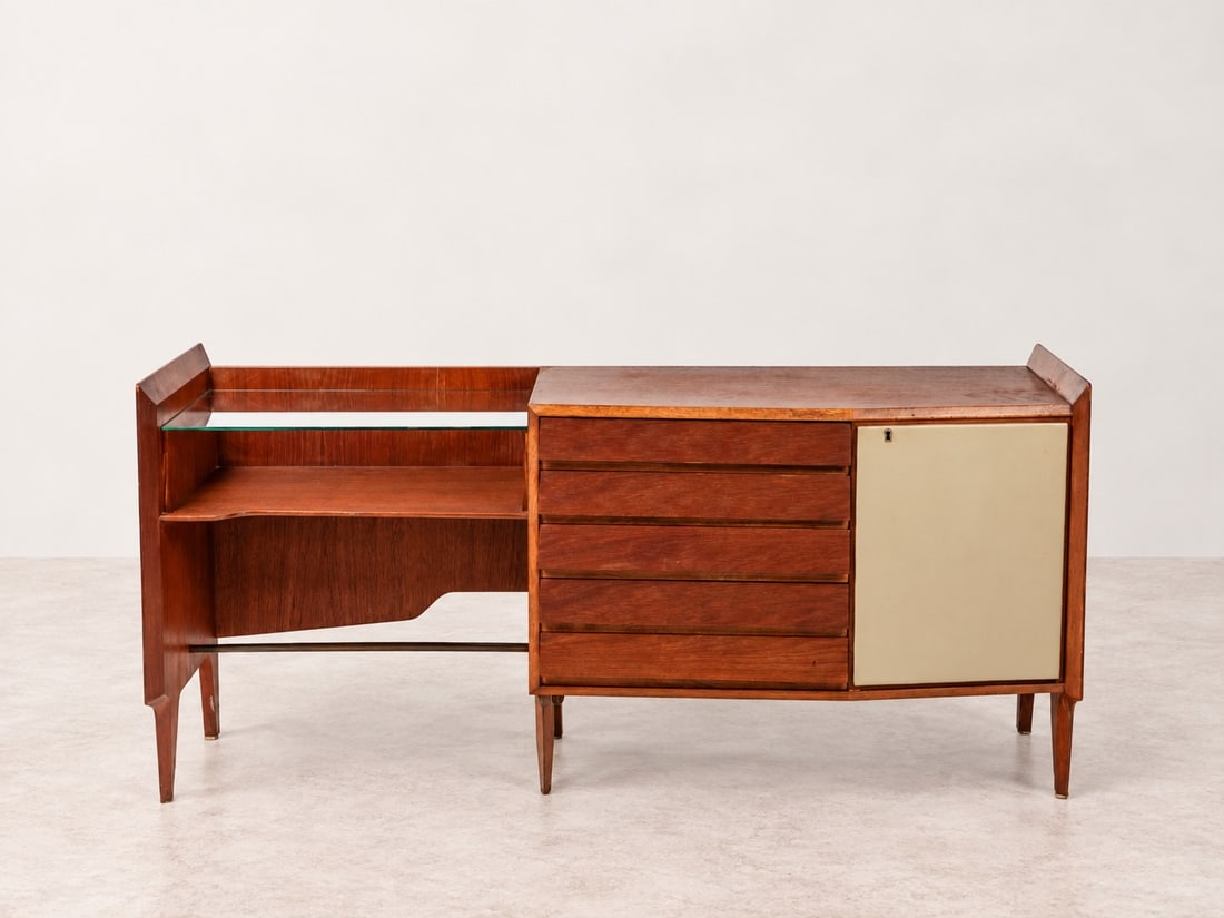 Gio Ponti (Milano 1891 - 1979), CABINET, circa 1950s: l cm 167 x h cm 80 x w cm 47 Veneered wood with glass top, four drawers, and a compartment with a skai-covered door. Produced by Dassi, Italy.