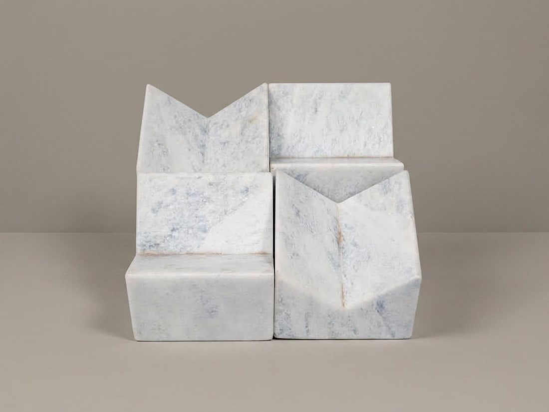 Giulio Lazzotti (Pietrasanta 1943 - 2024), "PETIT GRANIT" PAPERWEIGHTS, circa 1980: h cm 6,5 x l cm 9 x w cm 9 Set of four. Grey marble, Mageia production, Italy.