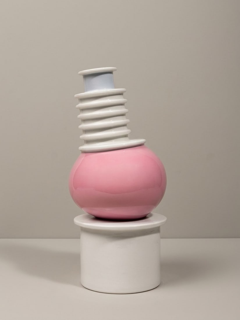 Ettore Sottsass (Innsbruck 1917 - 2007), "NILO" VASE, circa 1983: h cm 31 x d cm 14 White porcelain with stacked geometric elements. For the Memphis collection, executed by Porcellane San Marco, Nove, Bassano, Italy.Catalogue notes:See the example published in Fulvi