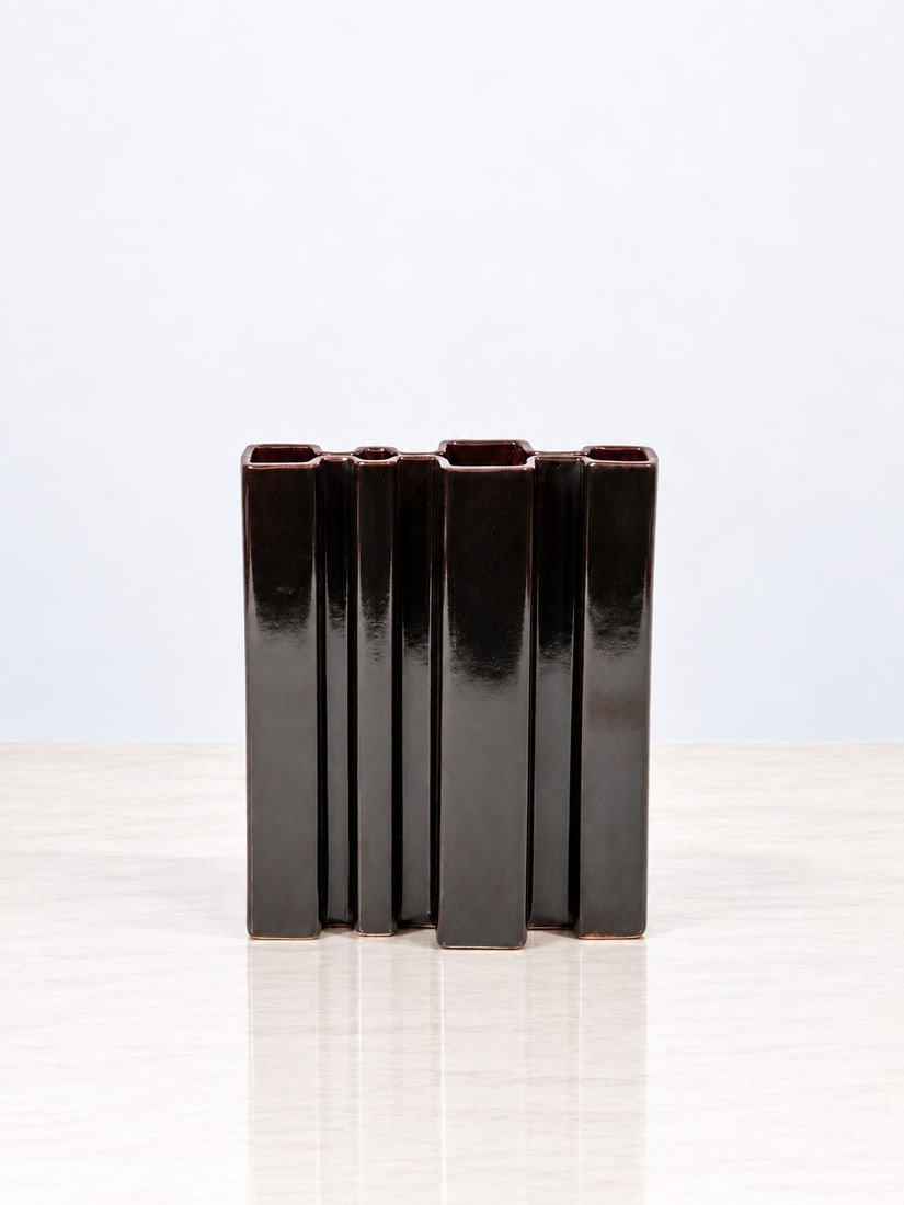 Angelo Mangiarotti (Milano 1921 - 2012), "M5" VASE, circa 1970s: h cm 26 x l cm 21,5 x p cm 7 Manganese-colored ceramic. Manufacturer's label to the underside. Produced by Fratelli Brambilla, Italy.